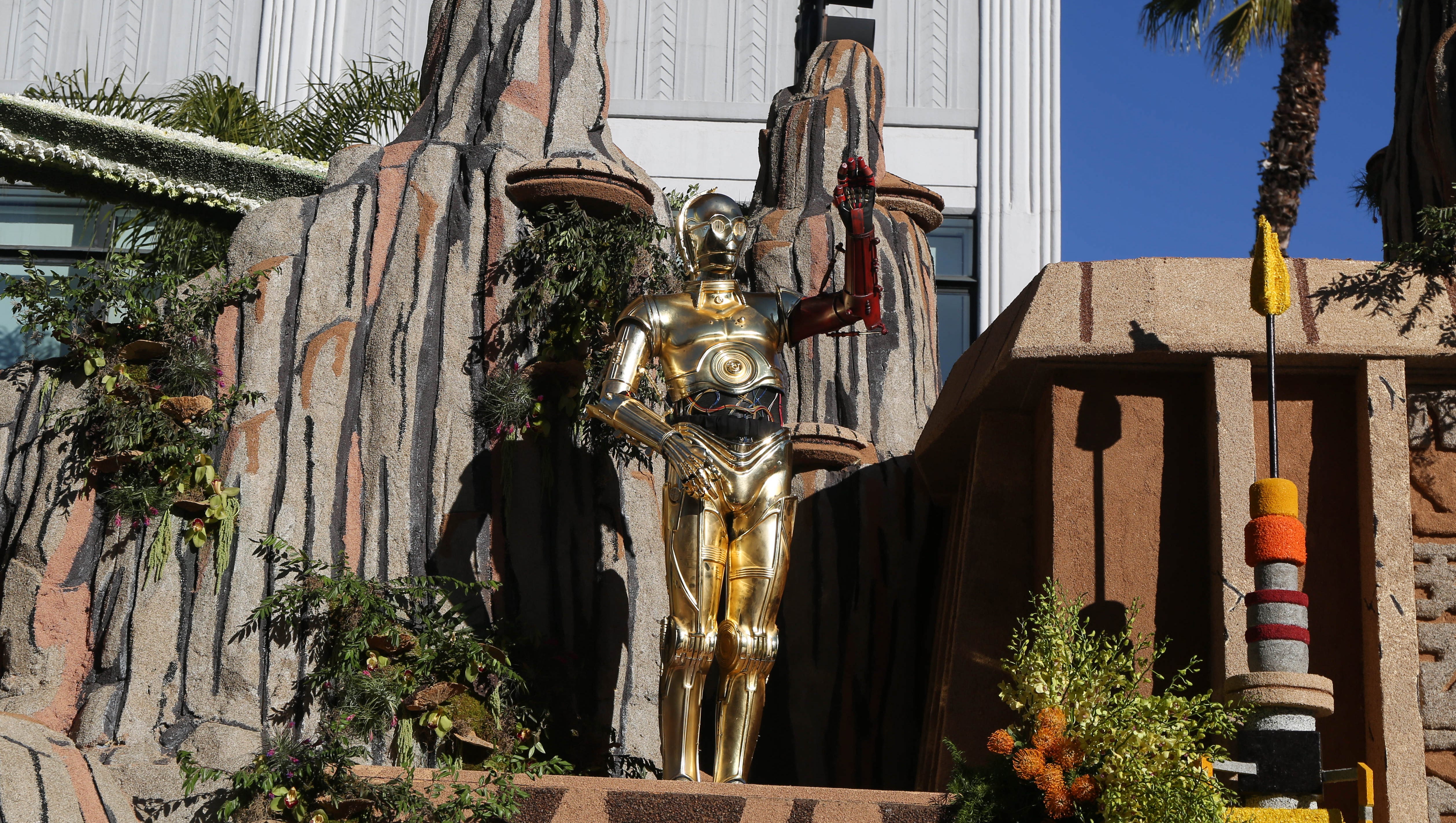 C-3P0 rides the Disney float on Friday, Jan. 1, 2016, during the 2016 Tournament of Roses Parade in Pasadena, Calif.
