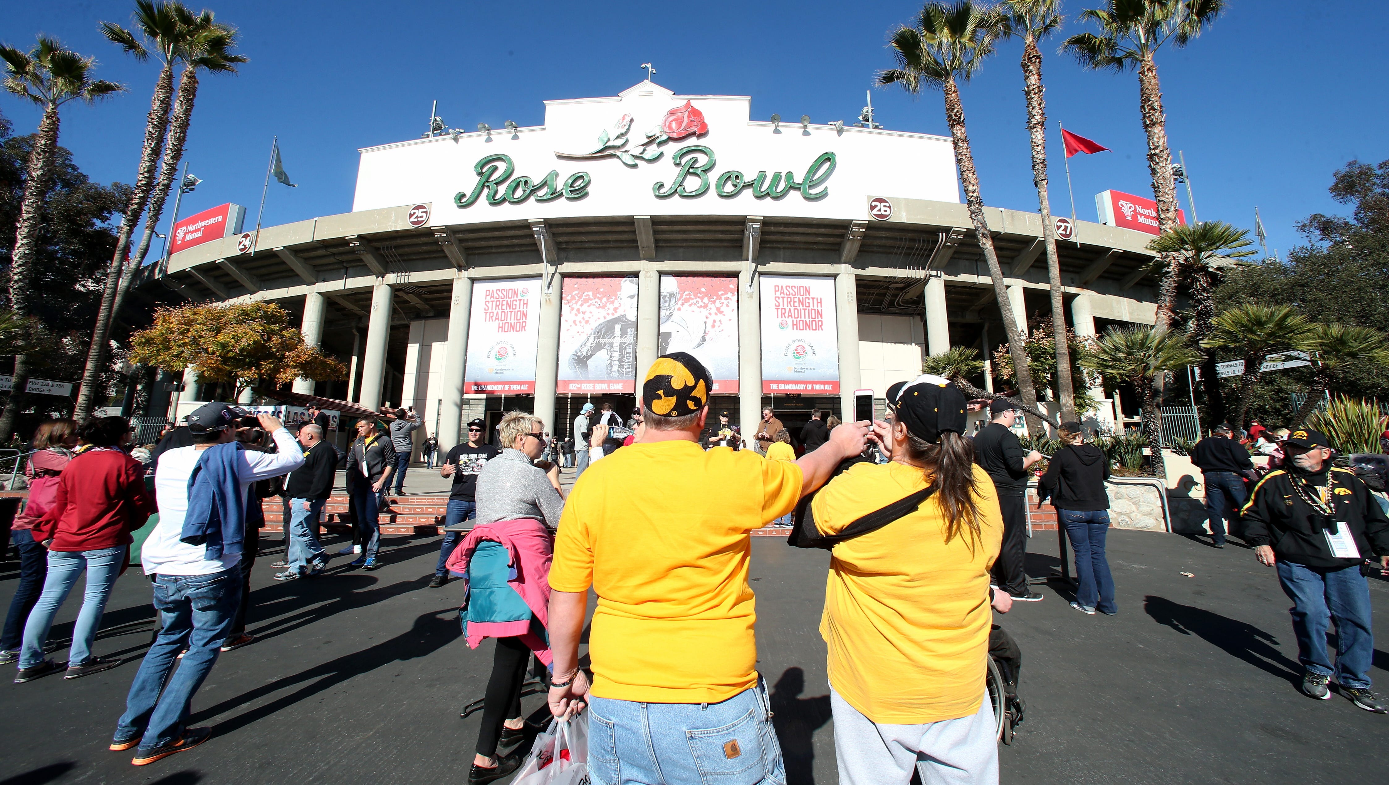 Iowa Hawkeyes fans pose outside the Rose Bowl before the 102nd Rose Bowl Game between the Hawkeyes and the Stanford Cardinal on January 1, 2016 at the Rose Bowl in Pasadena, California.