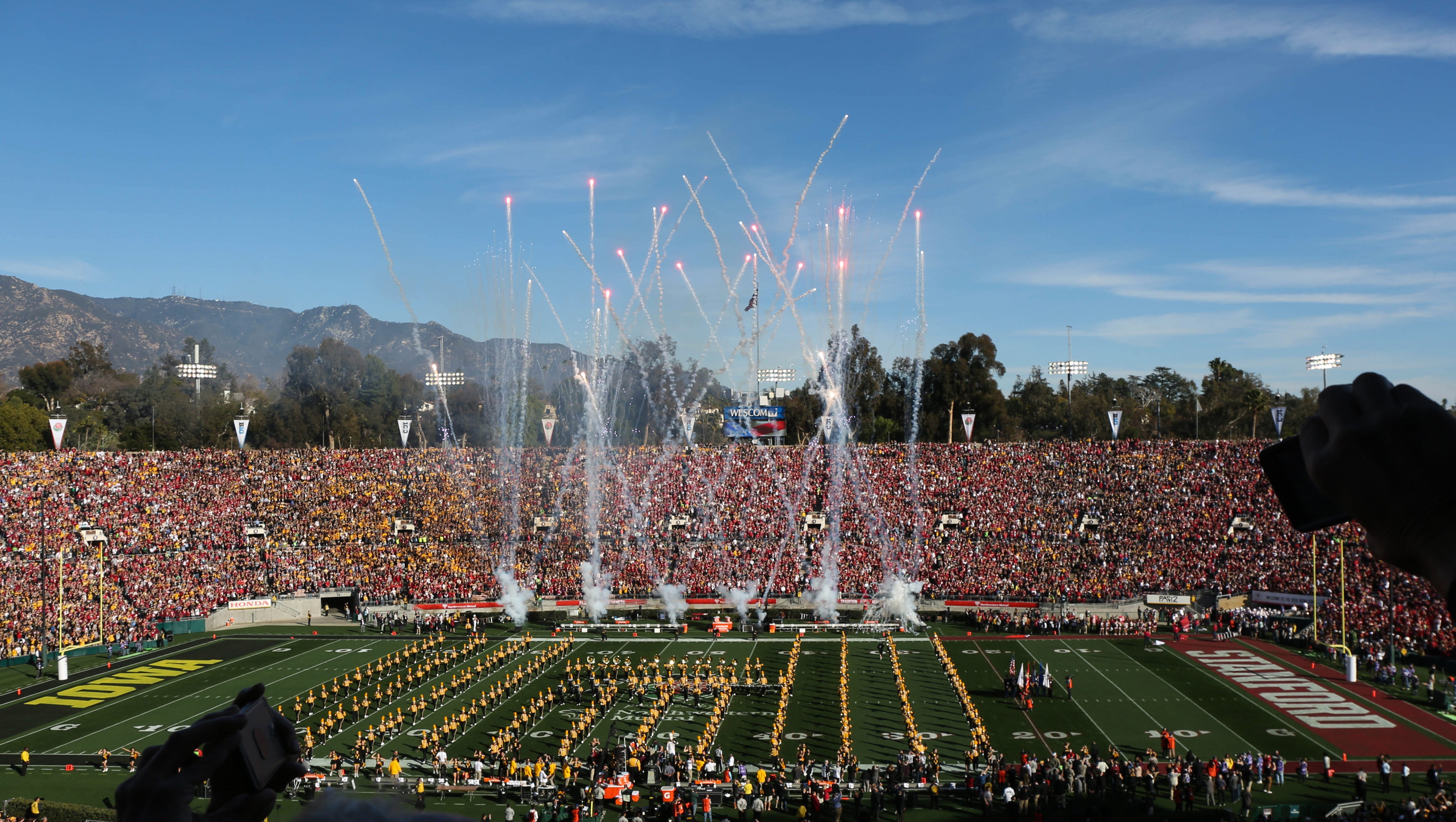 Iowa and Stanford fans fill the stadium on Friday, Jan. 1, 2016, as fireworks are shot off at the Rose Bowl in Pasadena, Calif.