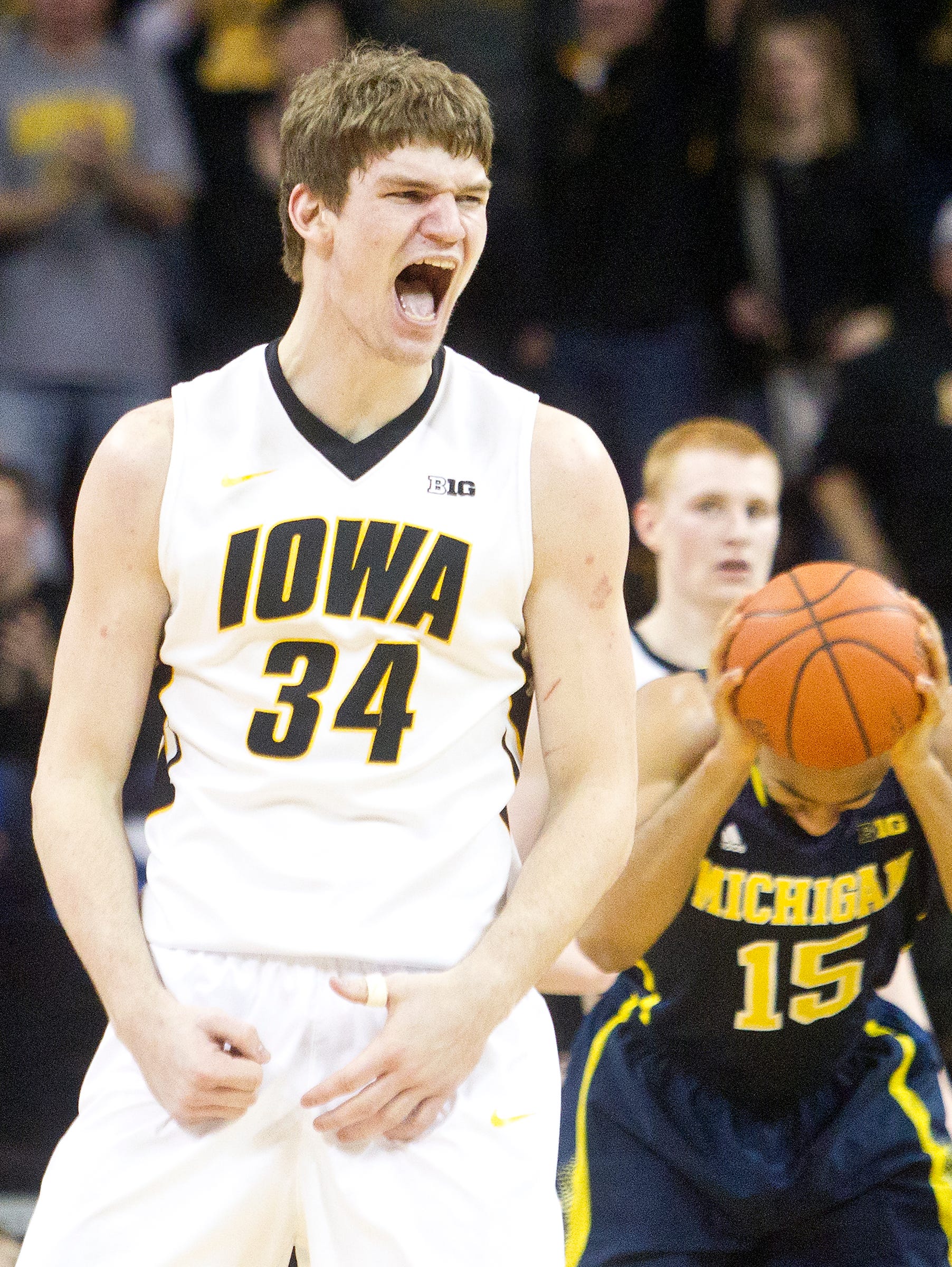 Iowa's Adam Woodbury reacts after forcing a jump ball during the Hawkeyes game against Michigan in Iowa CIty on Saturday, February 8, 2014.