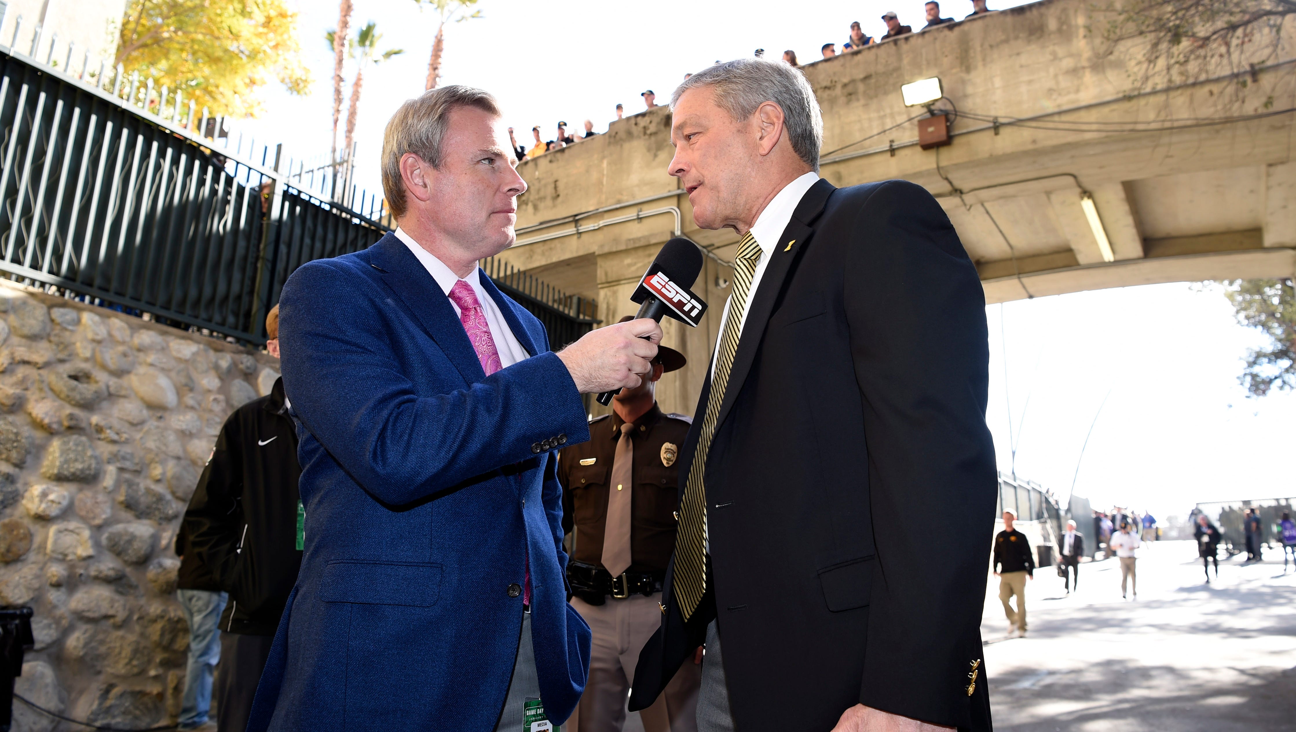 ESPN reporter Tom Rinaldi interviews Iowa Hawkeyes head coach Kirk Ferentz before the game between the Iowa Hawkeyes and the Stanford Cardinal in the 2016 Rose Bowl at Rose Bowl.