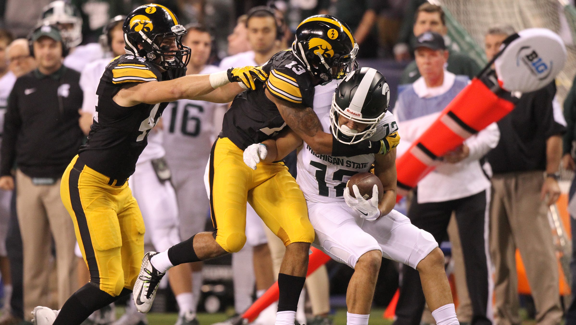 Iowa's Greg Mabin tackles Michigan State's R.J. Shelton during the Big Ten Championship game at Lucas Oil Stadium in Indianapolis, Ind. on Saturday, Dec. 5, 2015.