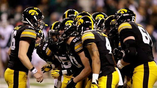 Iowa quarterback C.J. Beathard (16) calls a play against Michigan State during the first half of the Big Ten Conference championship NCAA college football game Saturday, Dec. 5, 2015, in Indianapolis.