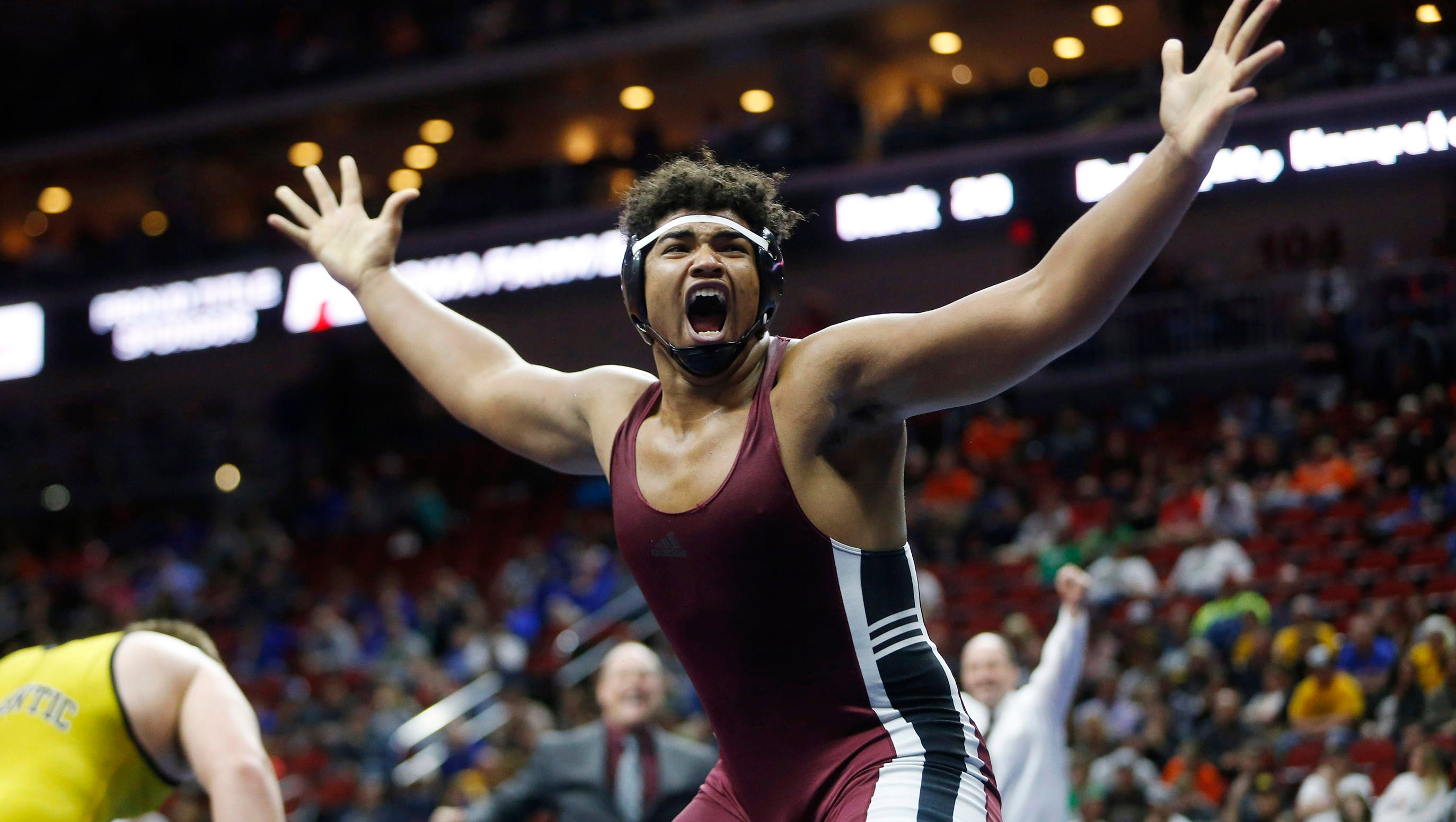 Mount Vernon's Tristan Wirfs celebrates his win in the class 2A, 220-pound title match Saturday, Feb. 18, 2017 in the state wrestling finals at Wells Fargo Arena in Des Moines.