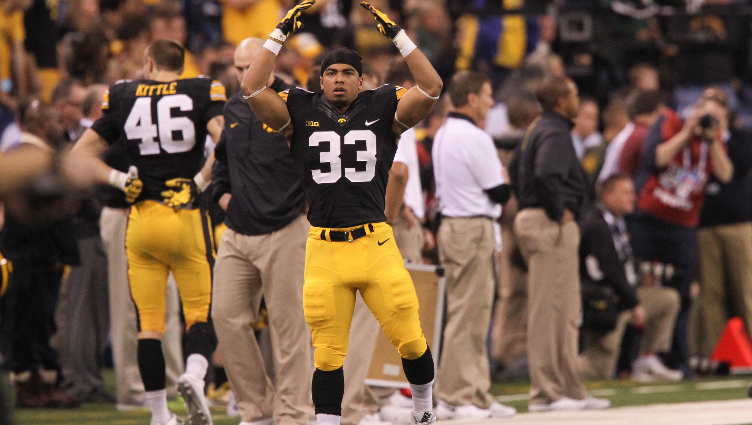 Iowa's Jordan Canzeri tries to pump up the crowd in the final minutes of the Hawkeyes' Big Ten Championship game against Michigan State at Lucas Oil Stadium in Indianapolis, Ind. on Saturday, Dec. 5, 2015.