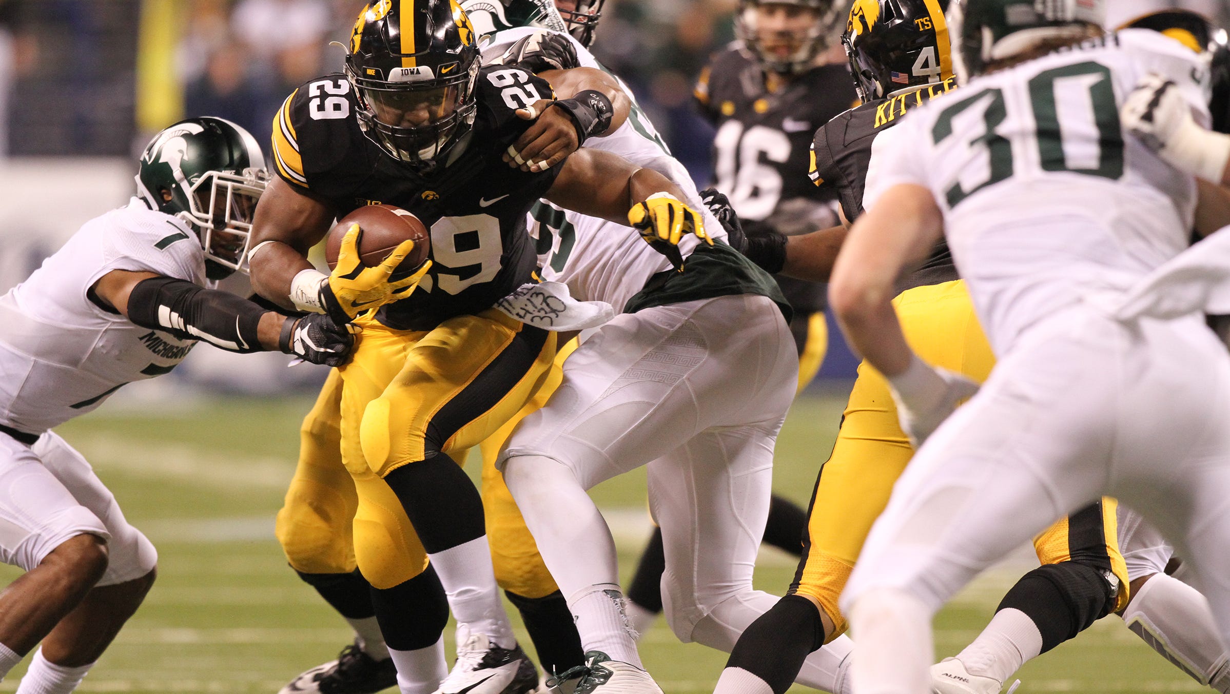 Iowa running back LeShun Daniels, Jr. runs down field during the Hawkeyes' Big Ten Championship game against Michigan State at Lucas Oil Stadium in Indianapolis, Ind. on Saturday, Dec. 5, 2015.