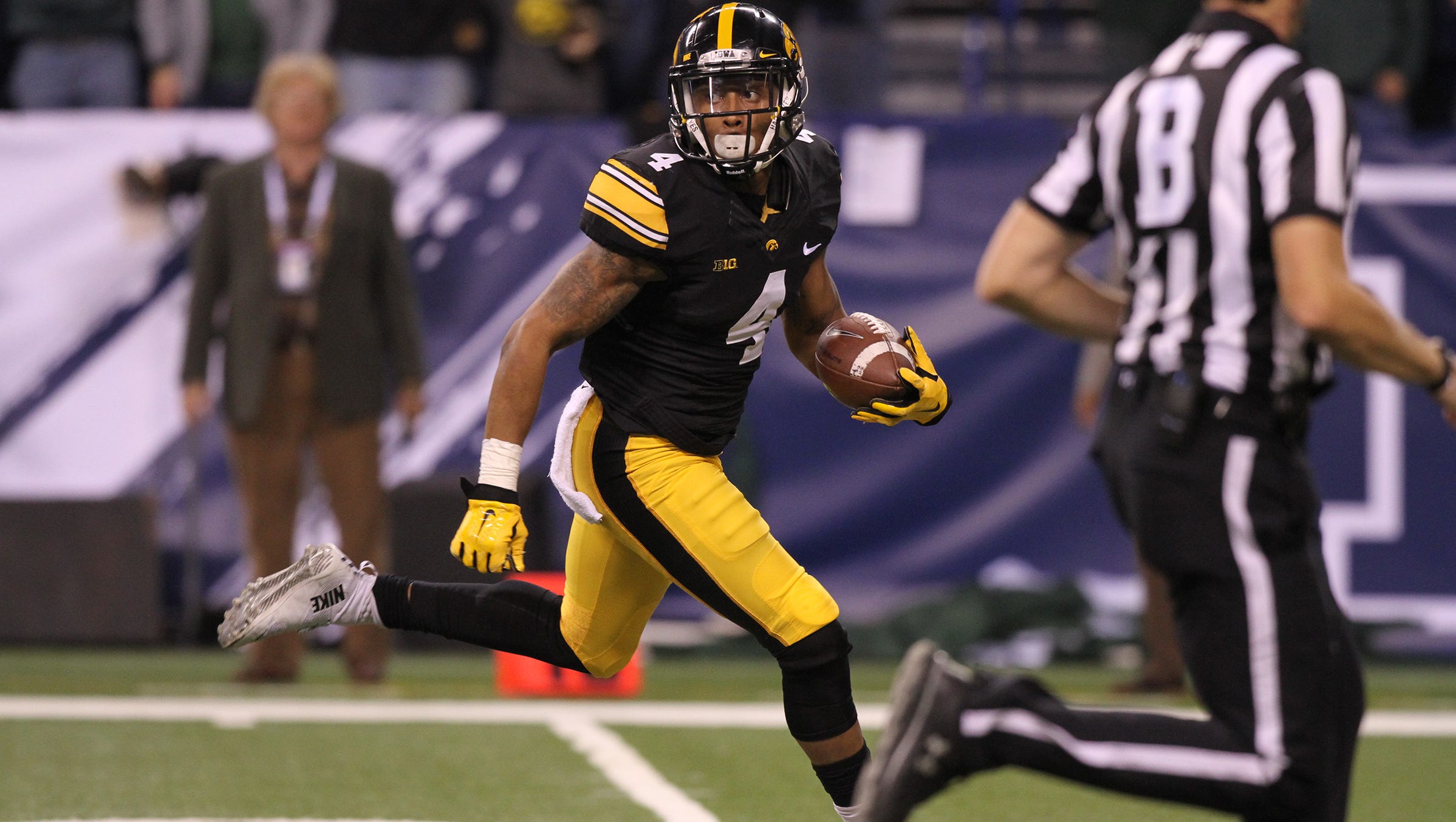 Iowa's Tevaun Smith runs down field for an 85-yard touchdown during the Hawkeyes' Big Ten Championship game against Michigan State at Lucas Oil Stadium in Indianapolis, Ind. on Saturday, Dec. 5, 2015.