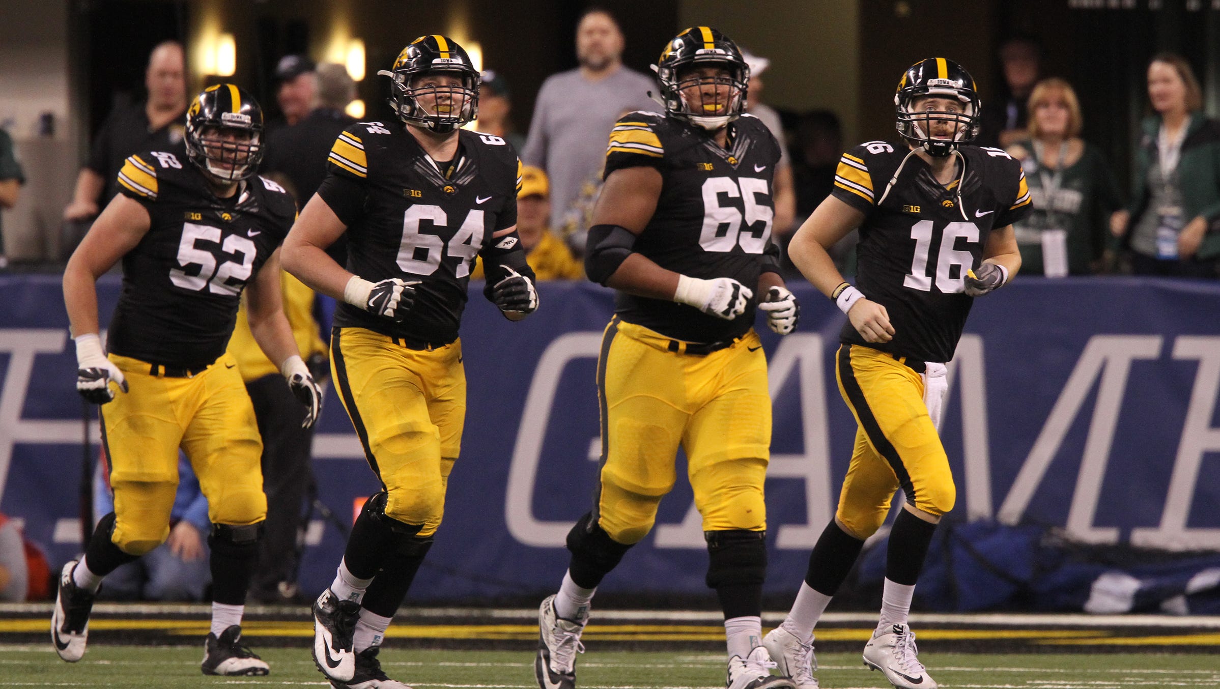 Iowa's offense heads to the bench during the Hawkeyes' Big Ten Championship game against Michigan State at Lucas Oil Stadium in Indianapolis, Ind. on Saturday, Dec. 5, 2015.