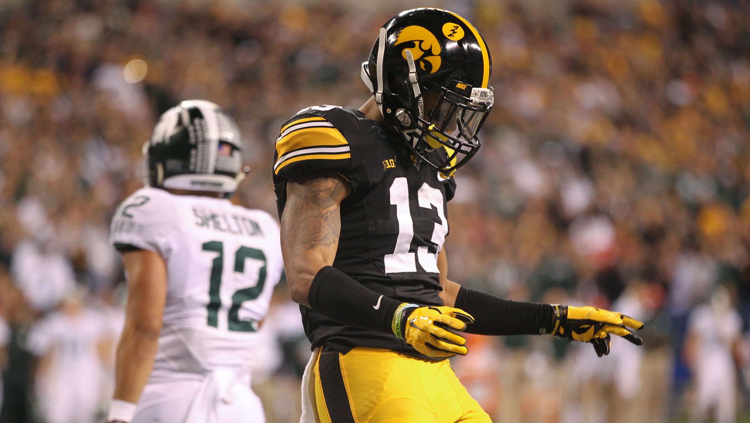 Iowa's Greg Mabin celebrates after forcing a fourth down during the Hawkeyes' Big Ten Championship game against Michigan State at Lucas Oil Stadium in Indianapolis, Ind. on Saturday, Dec. 5, 2015.