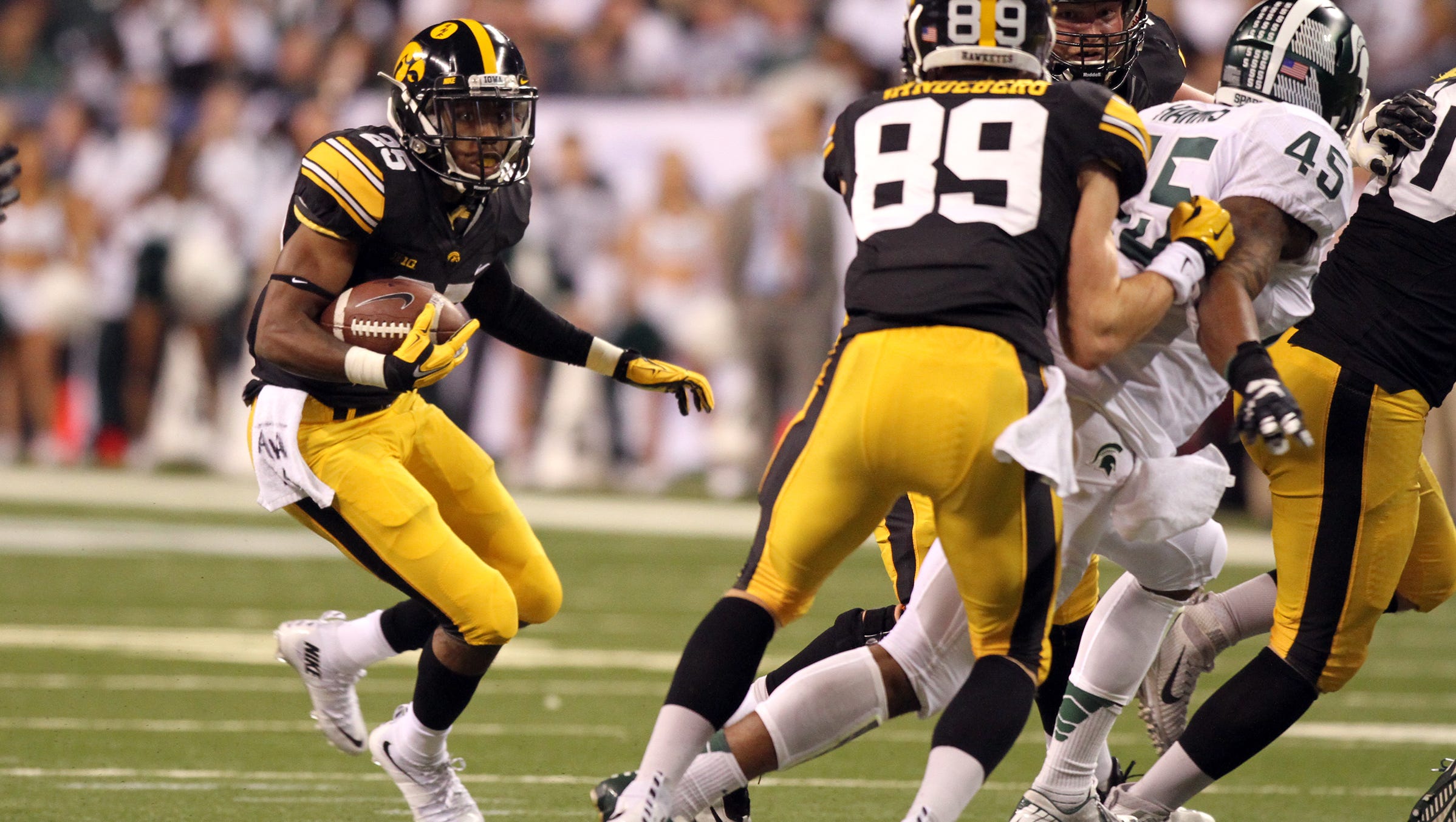 Iowa's Akrum Wadley runs down field during the Hawkeyes' Big Ten Championship game against Michigan State at Lucas Oil Stadium in Indianapolis, Ind. on Saturday, Dec. 5, 2015.