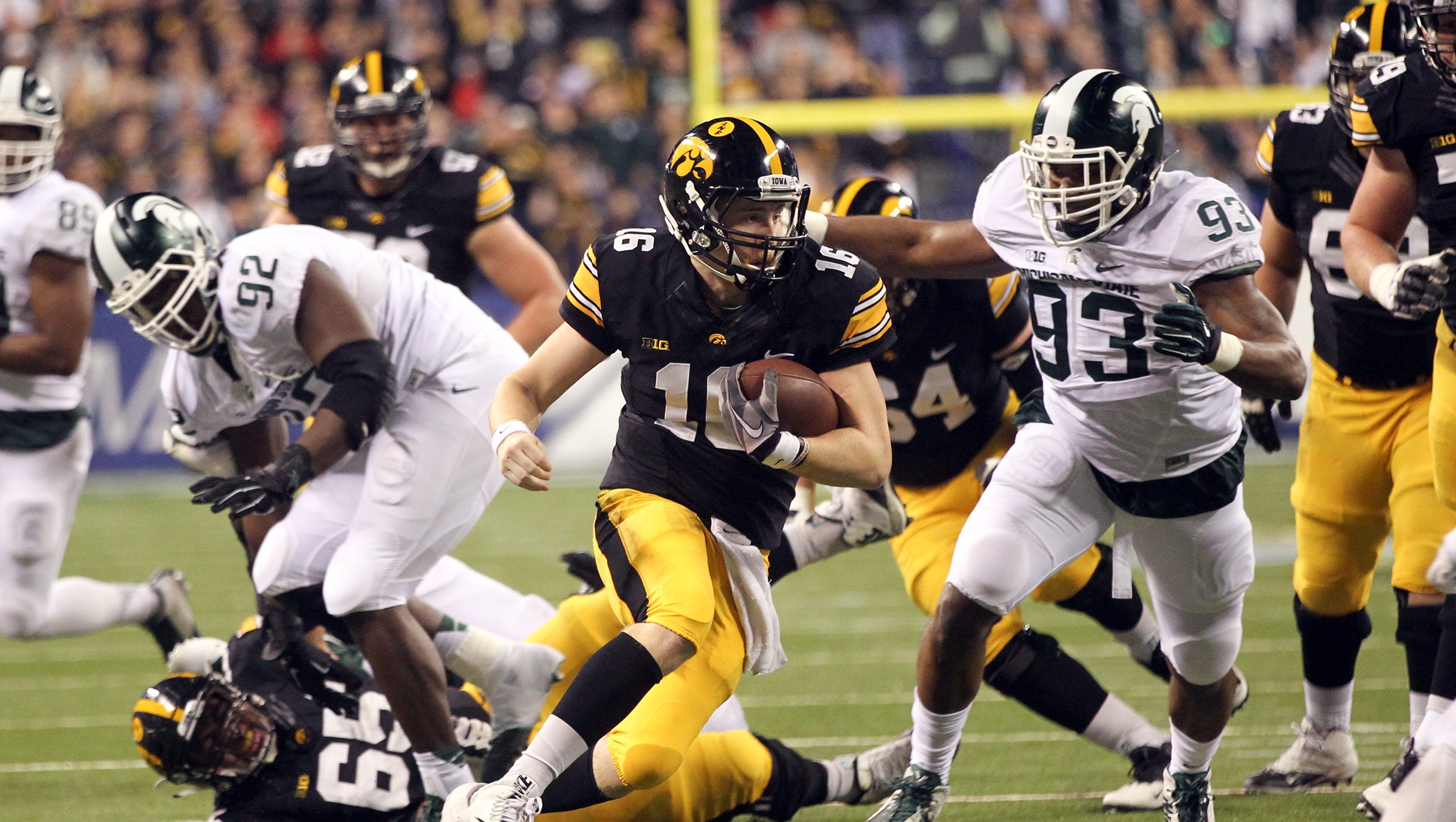 Iowa quarterback C.J. Beathard runs down field during the Hawkeyes' Big Ten Championship game against Michigan State at Lucas Oil Stadium in Indianapolis, Ind. on Saturday, Dec. 5, 2015.