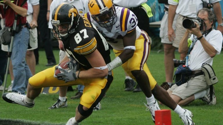Iowa's Scott Chandler is taken out of bounds by LSU's Jessie Daniels(31) after a 20 reception setting up for a Marques Simmons touchdown in the 4th quarter of the Capital One Bowl, January 1,2005, in Orlando, Fla.