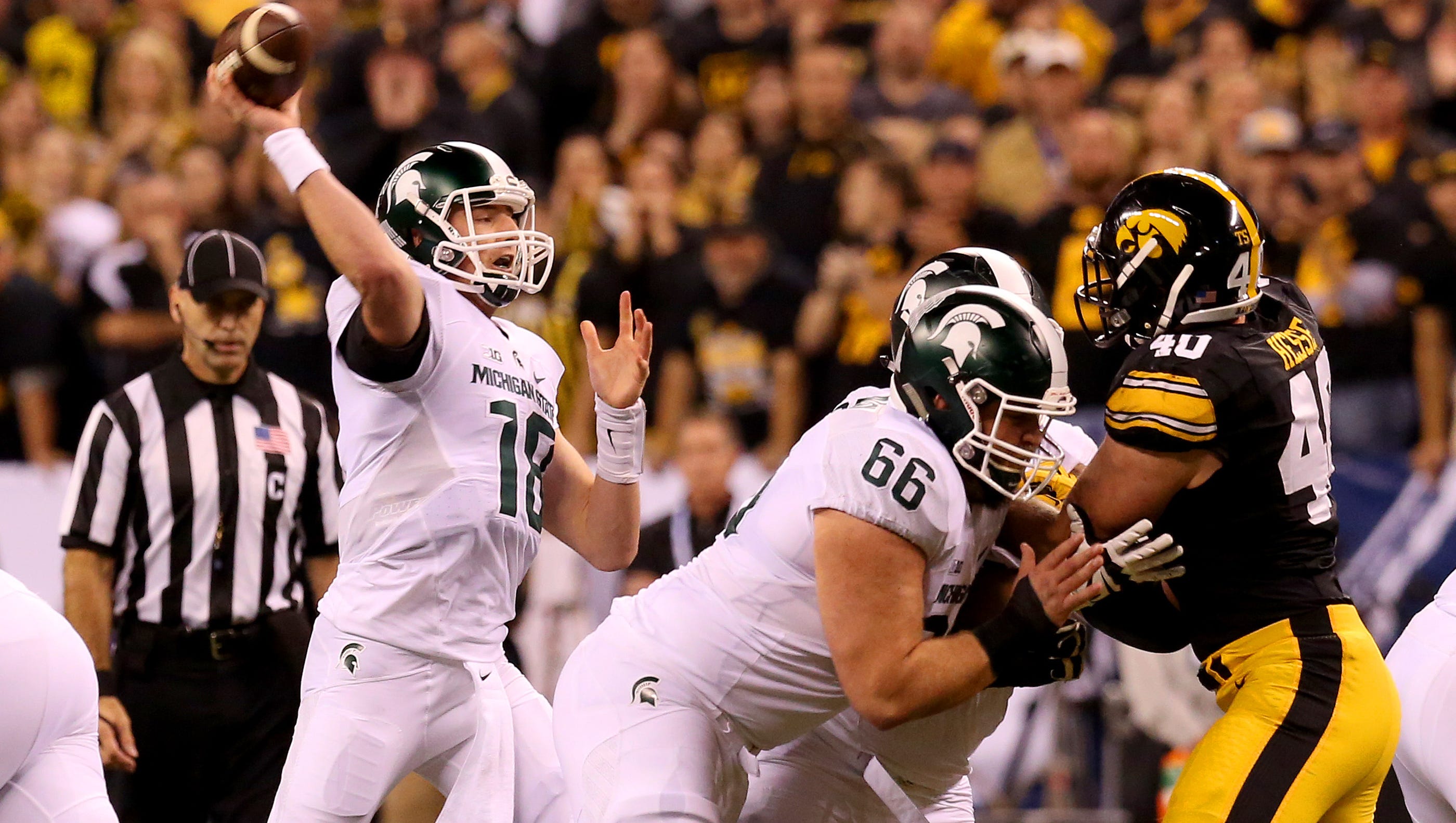 Michigan State quarterback Connor Cook (18) delivers a pass against Iowa during the Big Ten Championship Game at Lucas Oil Stadium on Dec. 5, 2015.