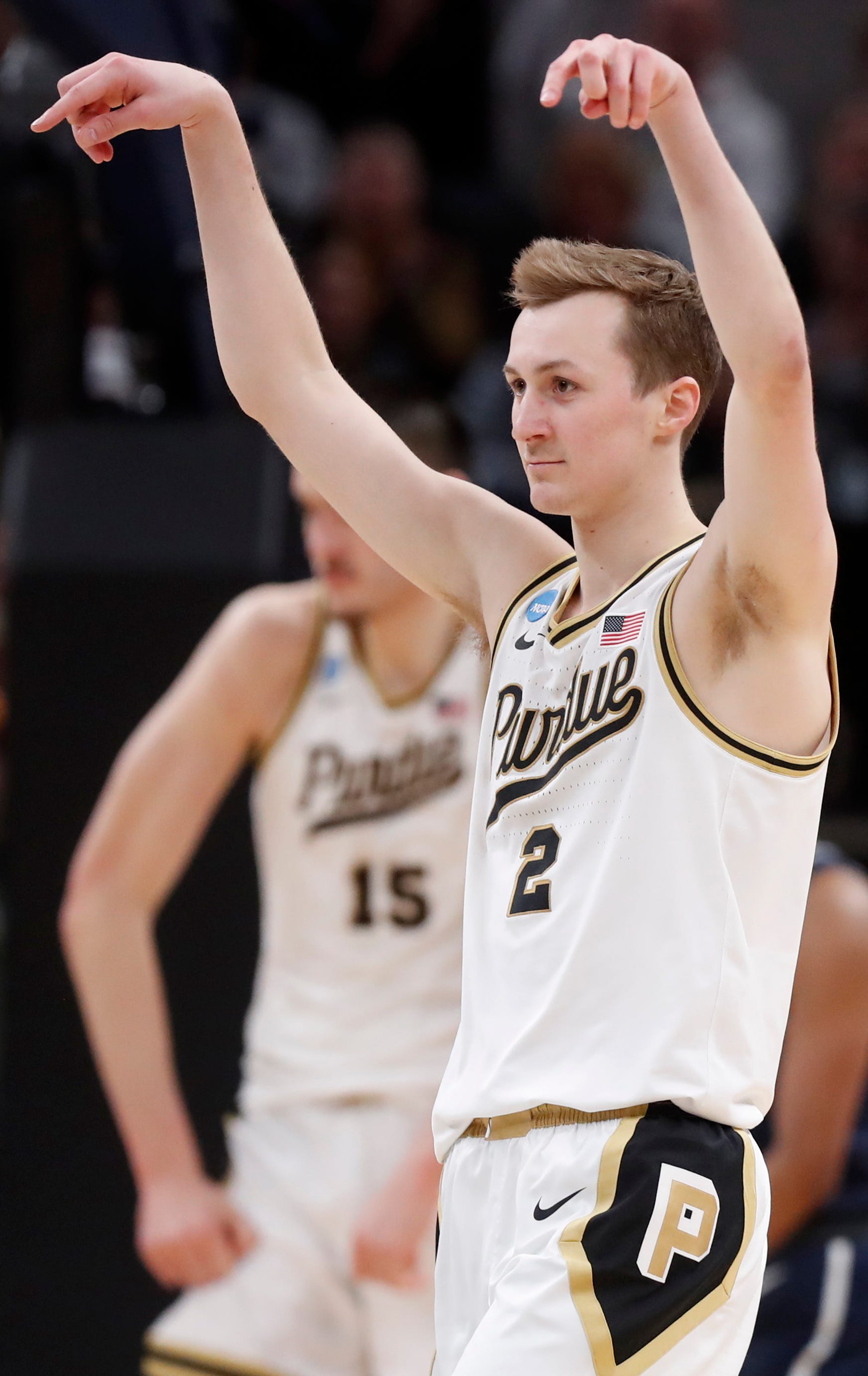 Purdue Boilermakers guard Fletcher Loyer (2) reacts after Purdue Boilermakers center Zach Edey (15) scores during NCAA Men’s Basketball Tournament game against the Utah State Aggies, Sunday, March 24, 2024, at Gainbridge Fieldhouse in Indianapolis.