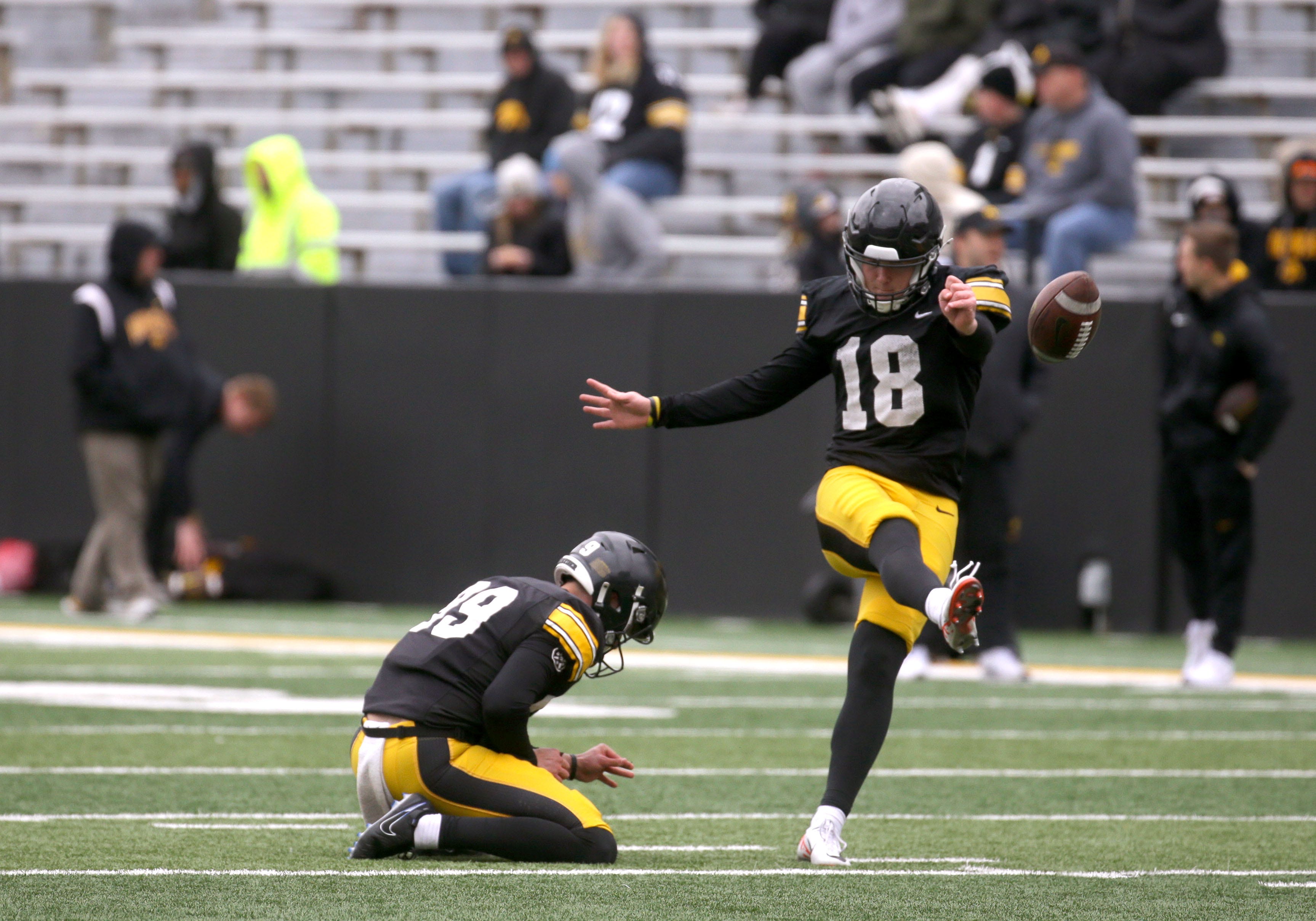 Iowa Hawkeyes kicker Drew Stevens (18) practices an extra point during an open spring practice Saturday, April 20, 2024 at Kinnick Stadium in Iowa City, Iowa.
