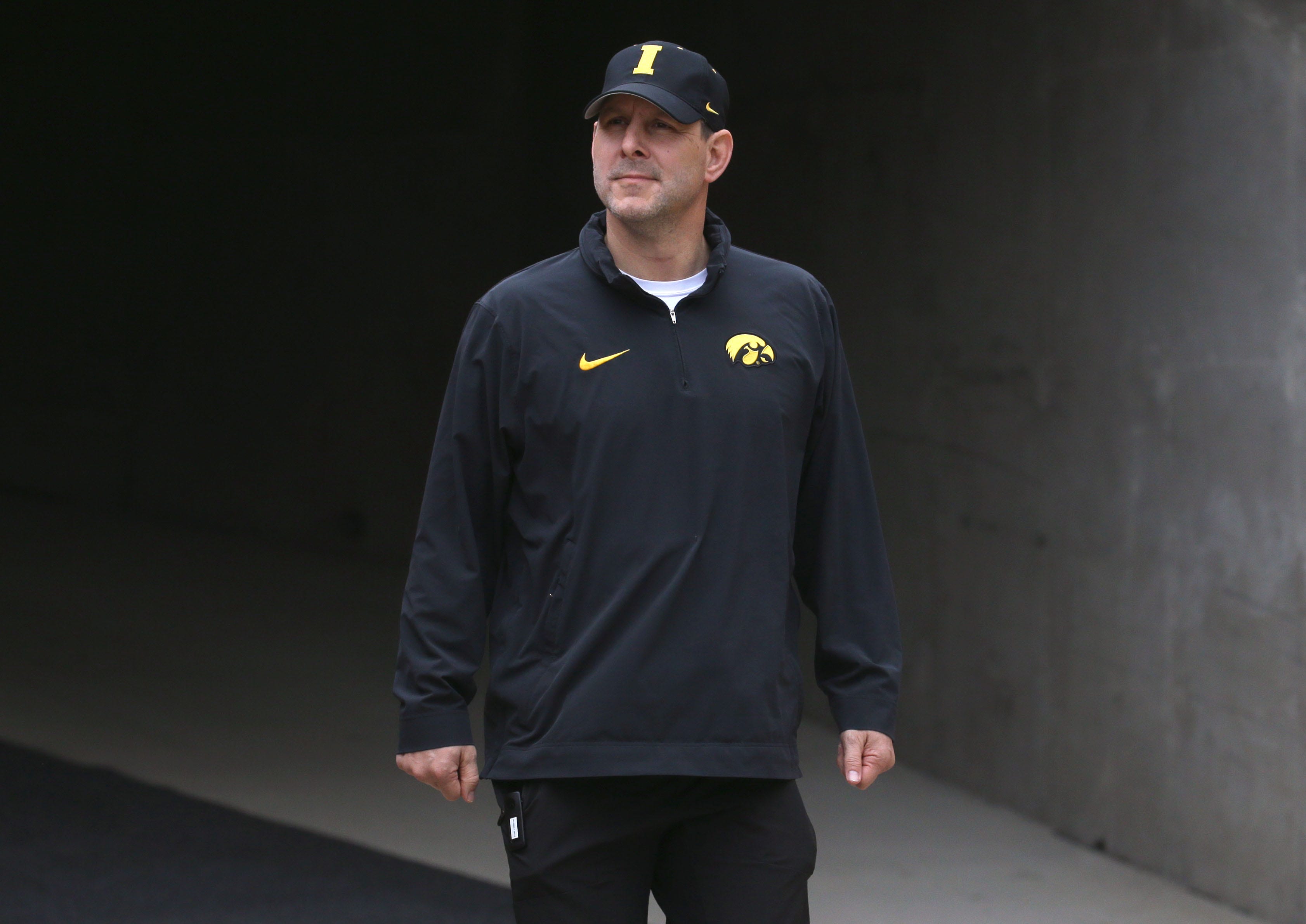 Iowa Hawkeyes offensive coordinator Tim Lester walks out of the tunnel ahead of an open spring practice Saturday, April 20, 2024 at Kinnick Stadium in Iowa City, Iowa.