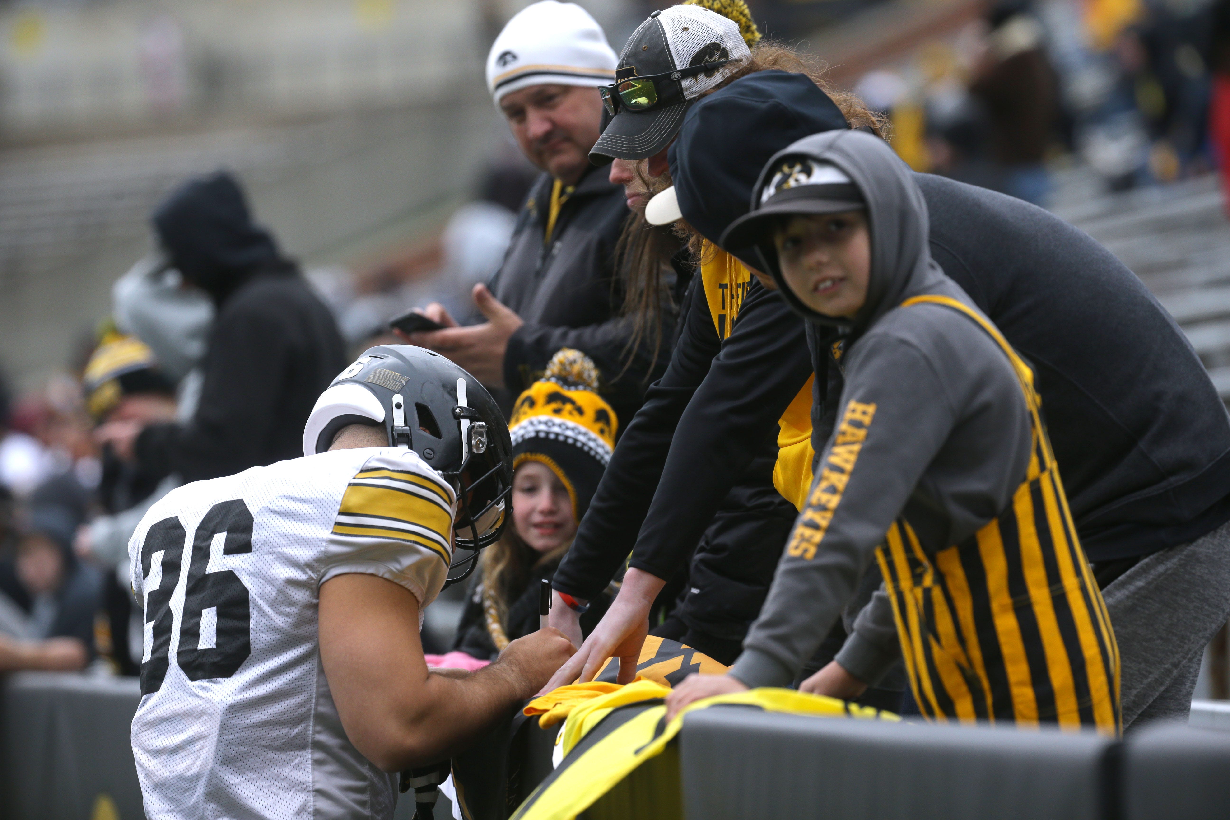 Iowa Hawkeyes linebacker Jayden Montgomery signs autographs for fans during an open spring practice Saturday, April 20, 2024 at Kinnick Stadium in Iowa City, Iowa.