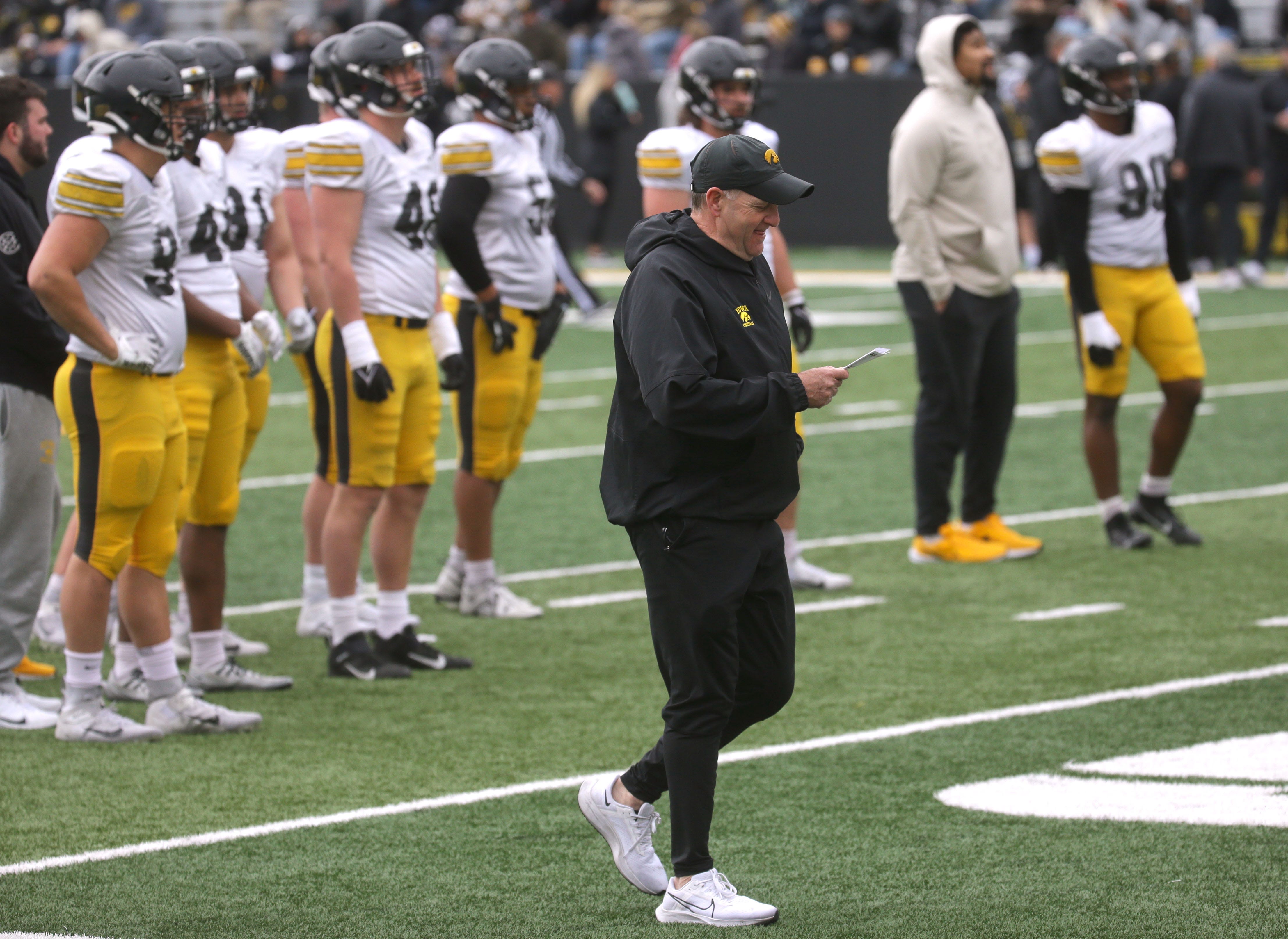Iowa Hawkeyes defensive coordinator Phil Parker consults his play sheet during an open spring practice Saturday, April 20, 2024 at Kinnick Stadium in Iowa City, Iowa.