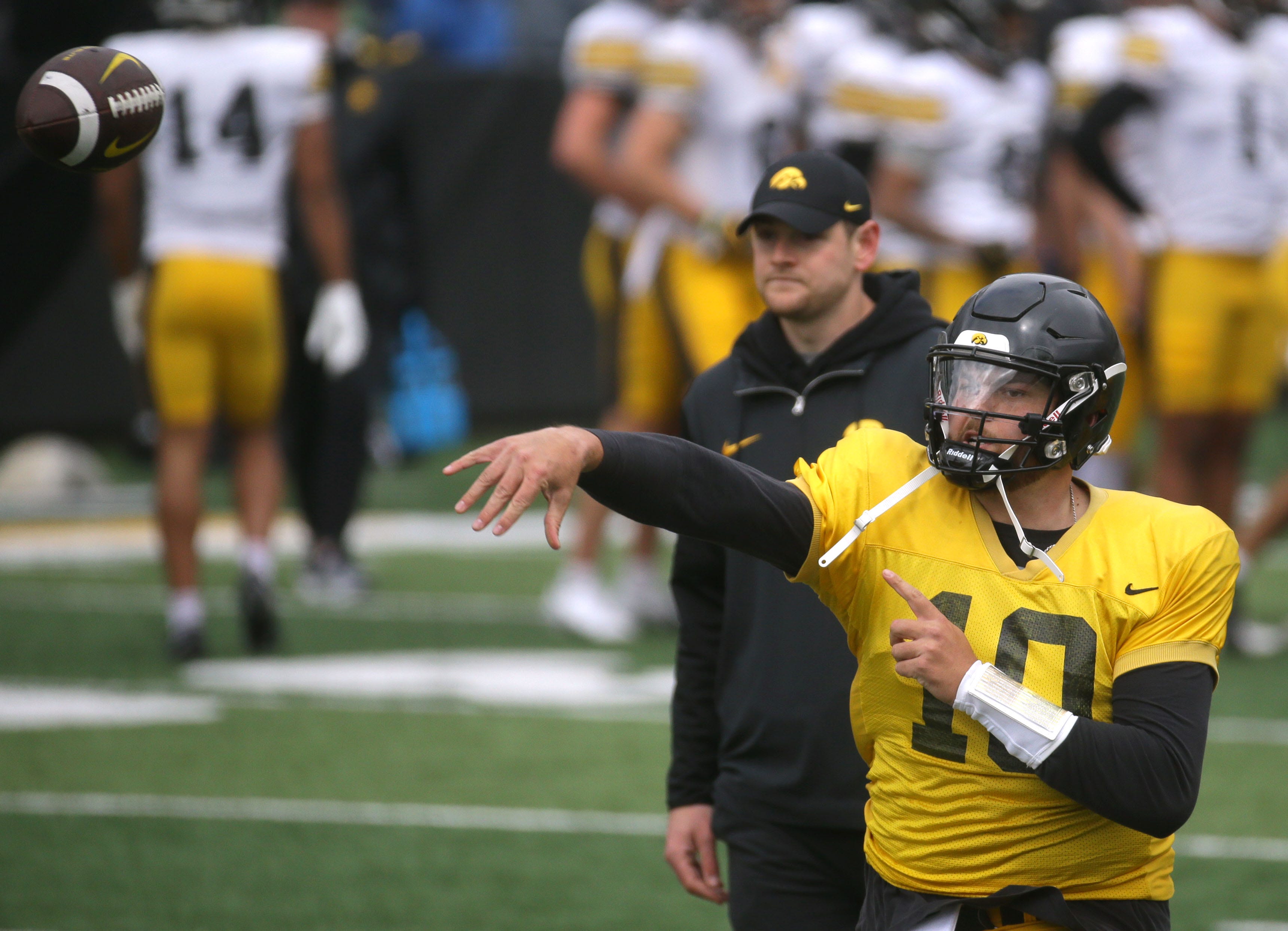 Iowa Hawkeyes quarterback Deacon Hill (10) throws the ball during an open spring practice Saturday, April 20, 2024 at Kinnick Stadium in Iowa City, Iowa.