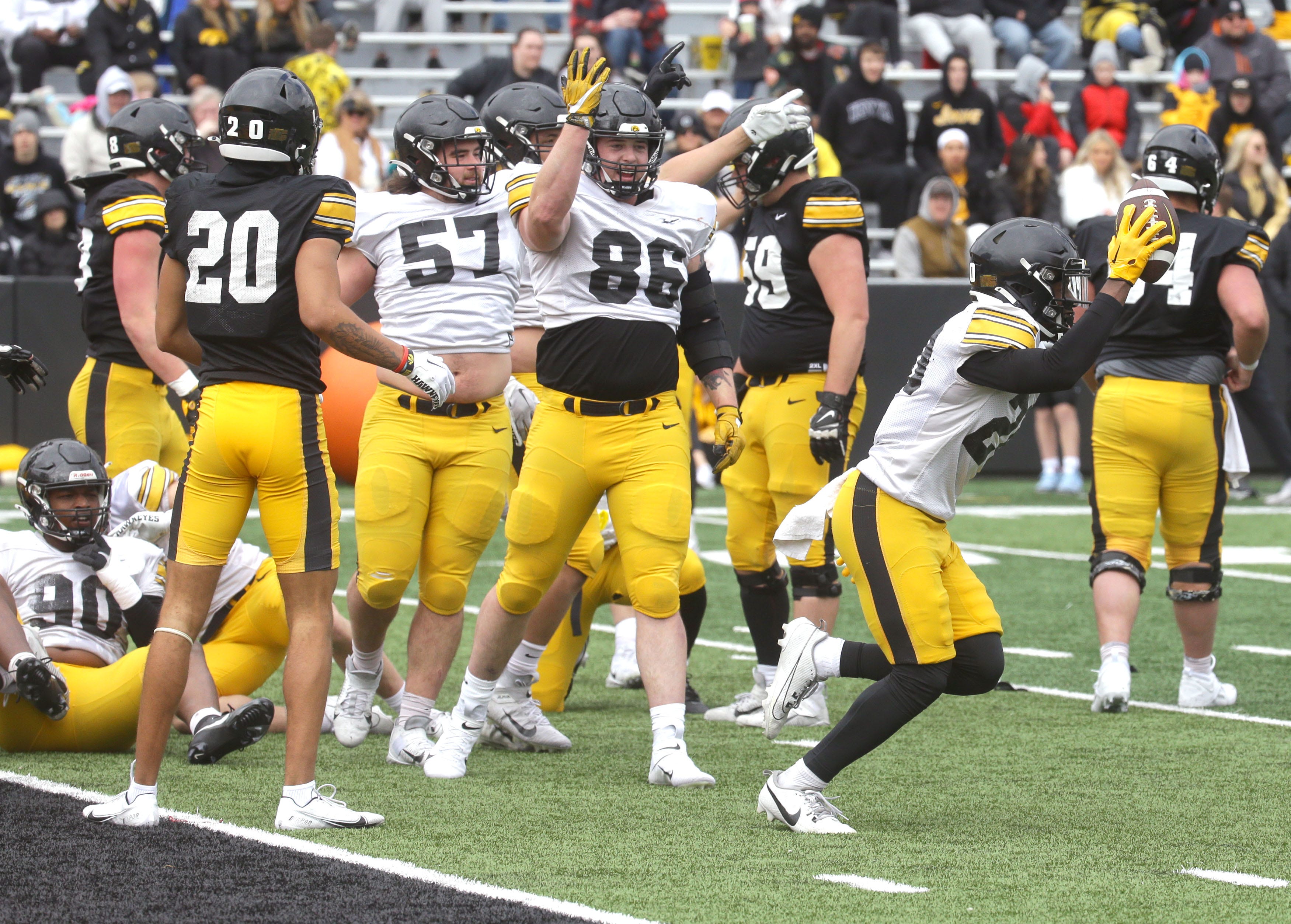 Iowa Hawkeyes defensive back Deavin Hilson (20) celebrates recovering a loose ball during an open spring practice Saturday, April 20, 2024 at Kinnick Stadium in Iowa City, Iowa.