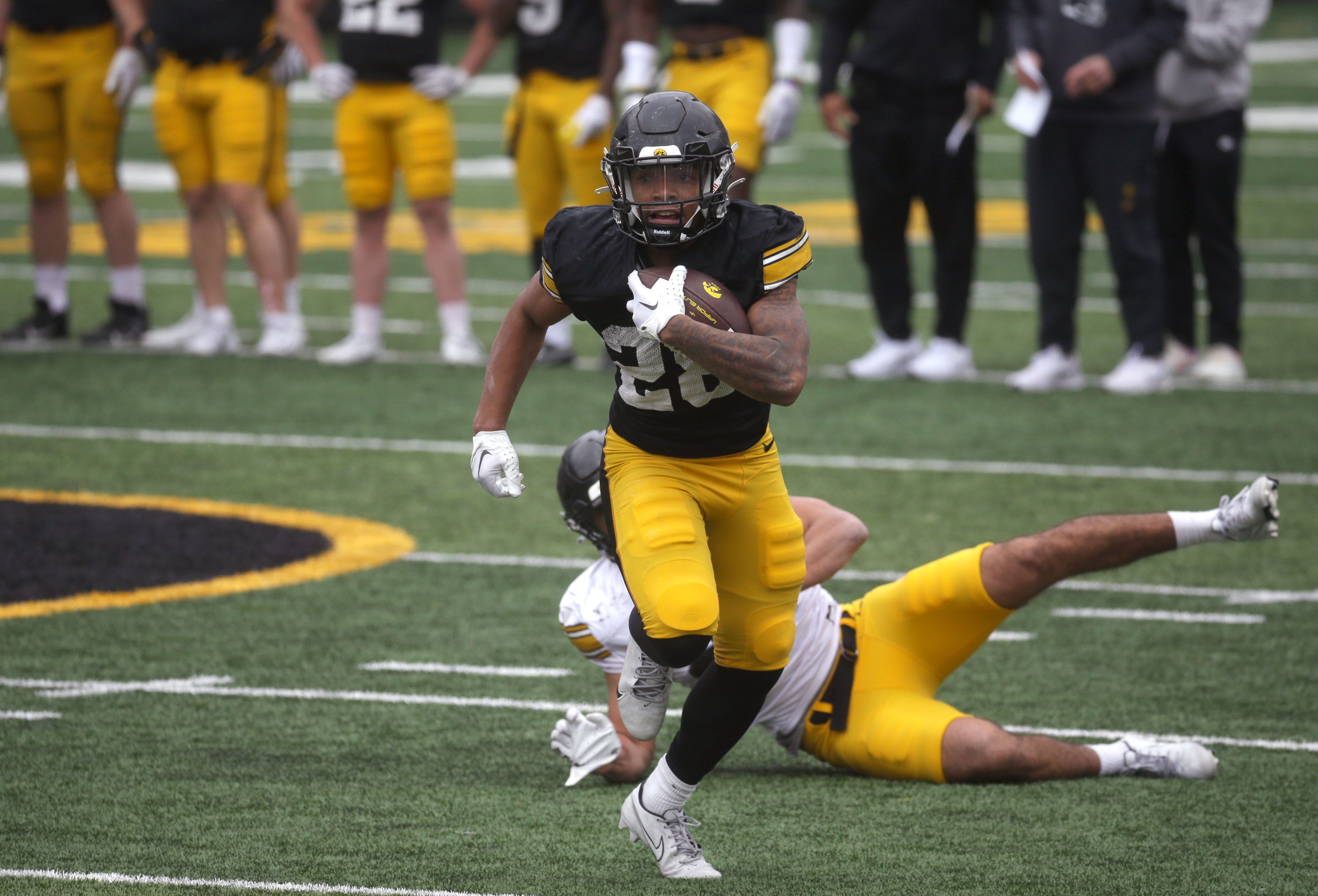Iowa Hawkeyes running back Kamari Moulton (28) races down field after breaking a tackle during an open spring practice Saturday, April 20, 2024 at Kinnick Stadium in Iowa City, Iowa.