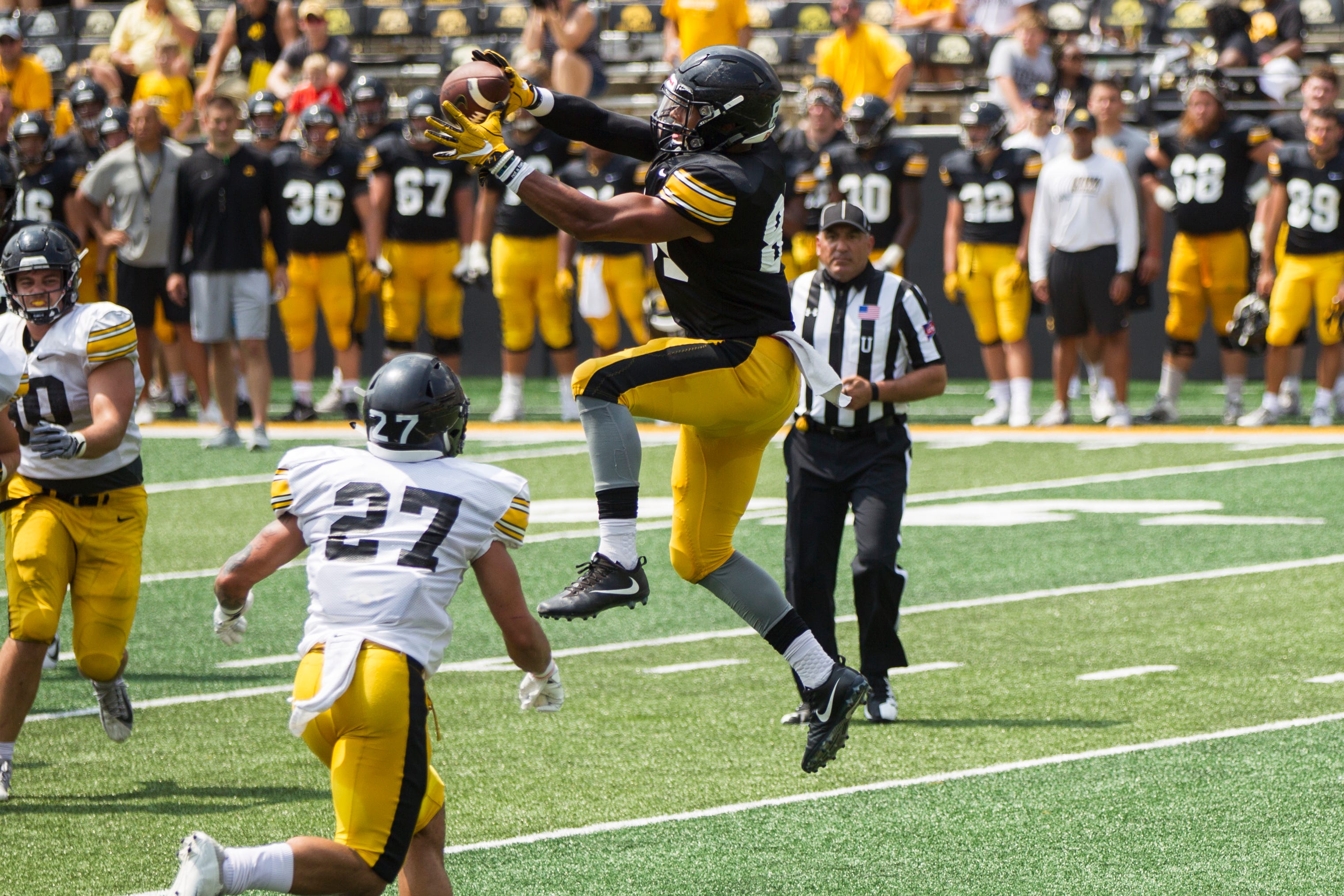 Iowa tight end Noah Fant (87) catches a pass during a Kids Day practice on Saturday, Aug. 11, 2018, at Kinnick Stadium in Iowa City.