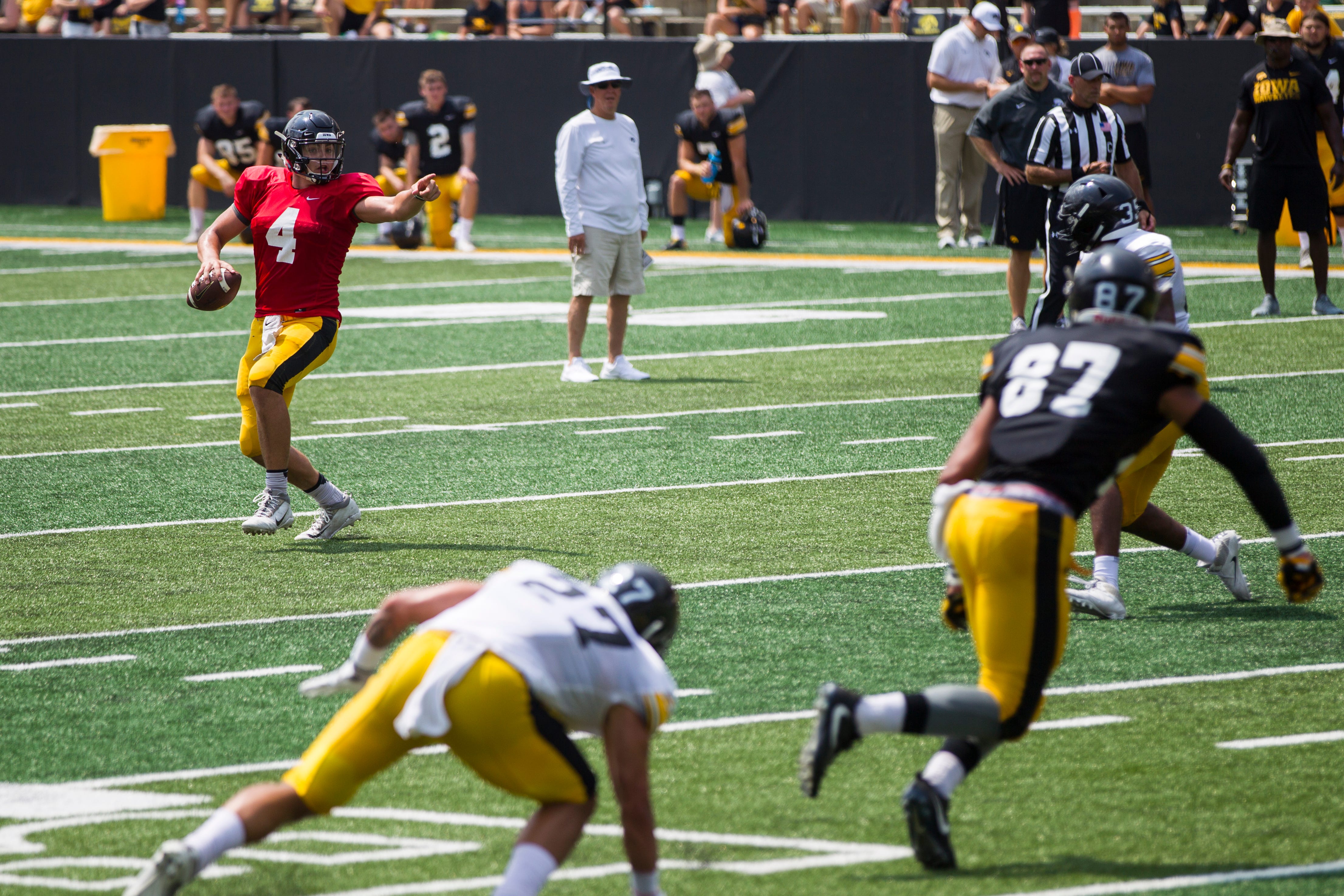 Iowa quarterback Nate Stanley gestures to tight end Noah Fant (87) during a Kids Day practice on Saturday, Aug. 11, 2018, at Kinnick Stadium in Iowa City.