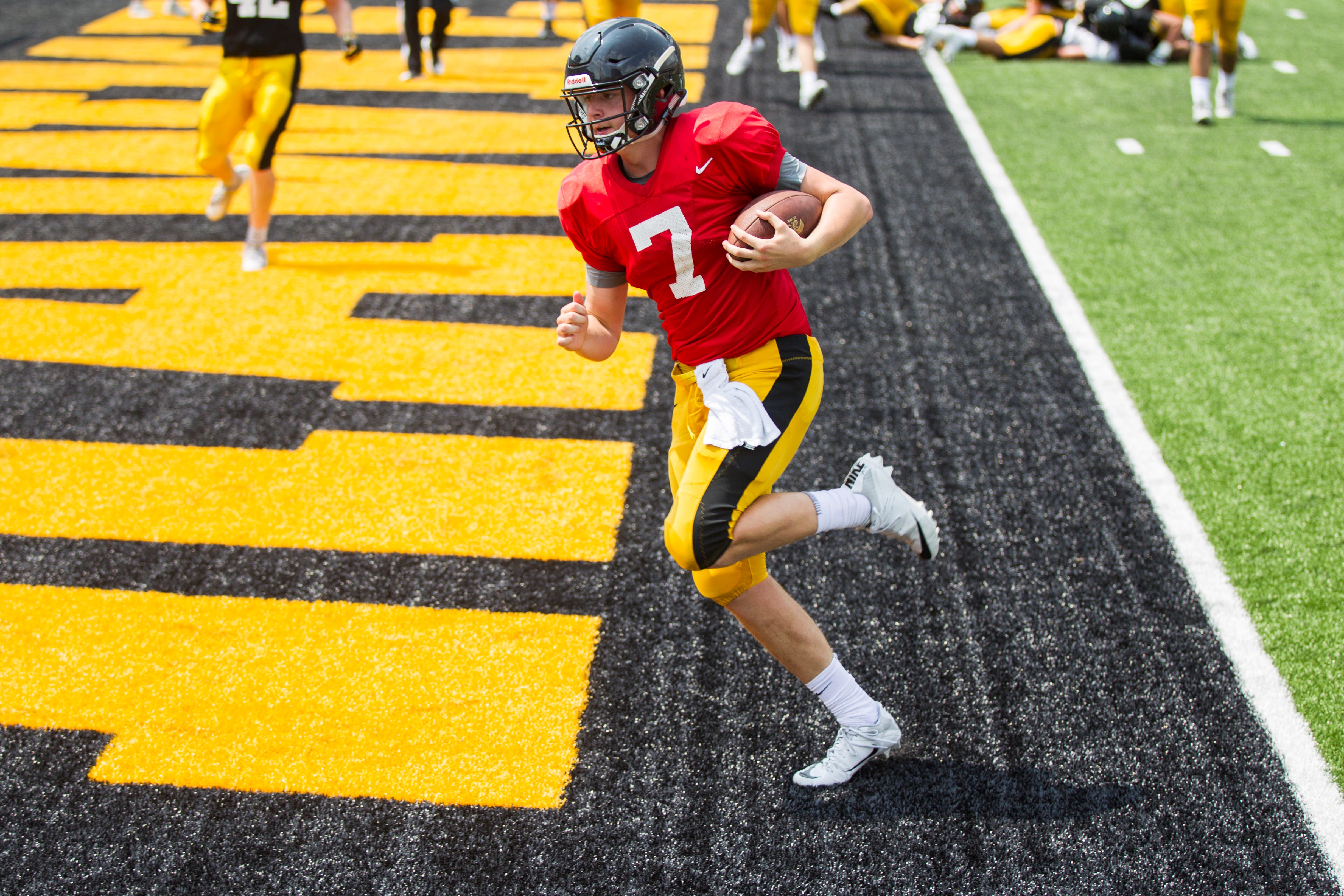 Iowa quarterback Spencer Petras crosses the goal line on a rush during a Kids Day practice on Saturday, Aug. 11, 2018, at Kinnick Stadium in Iowa City.