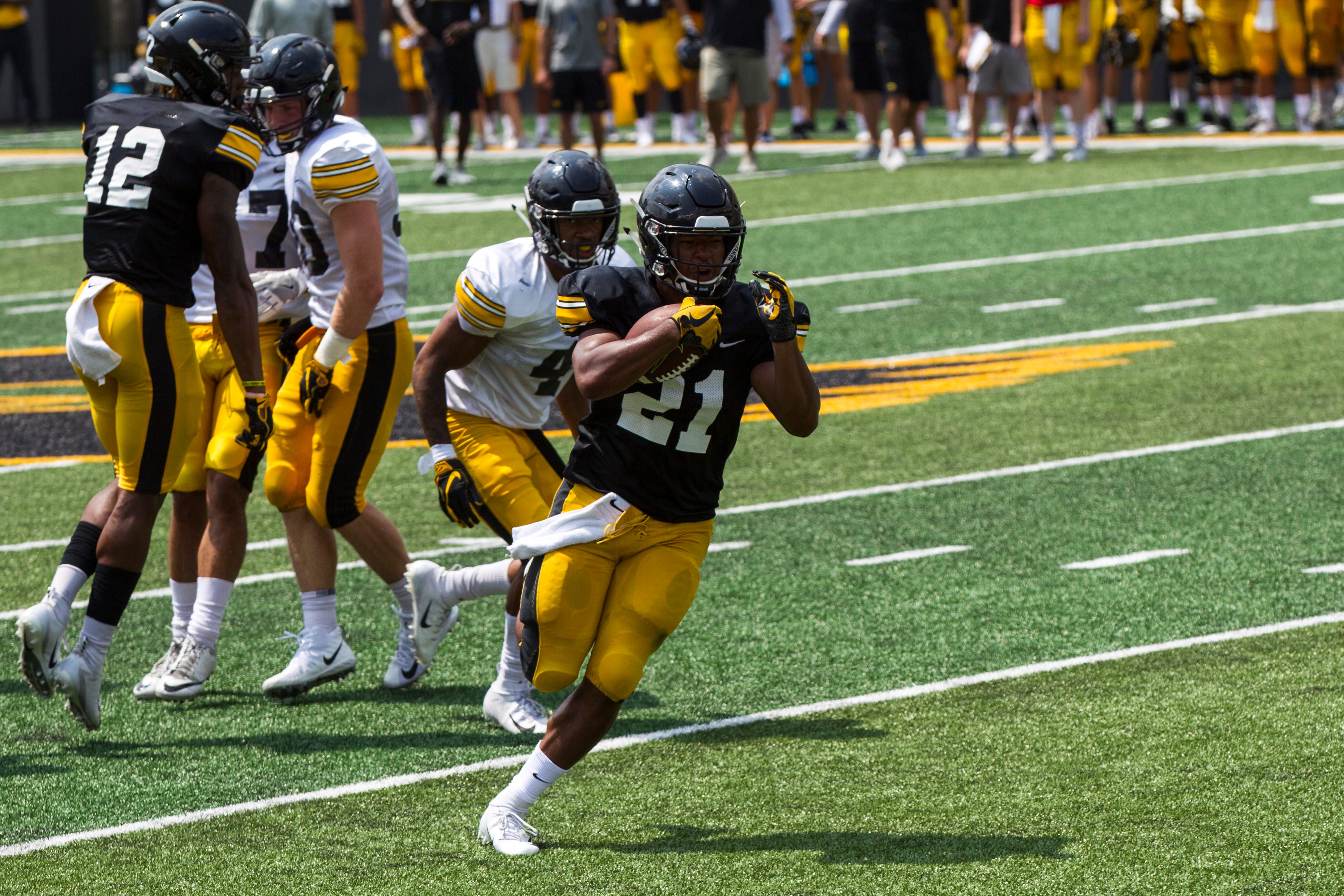 Iowa running back Ivory-Kelly Martin runs the ball during a Kids Day practice on Saturday, Aug. 11, 2018, at Kinnick Stadium in Iowa City.