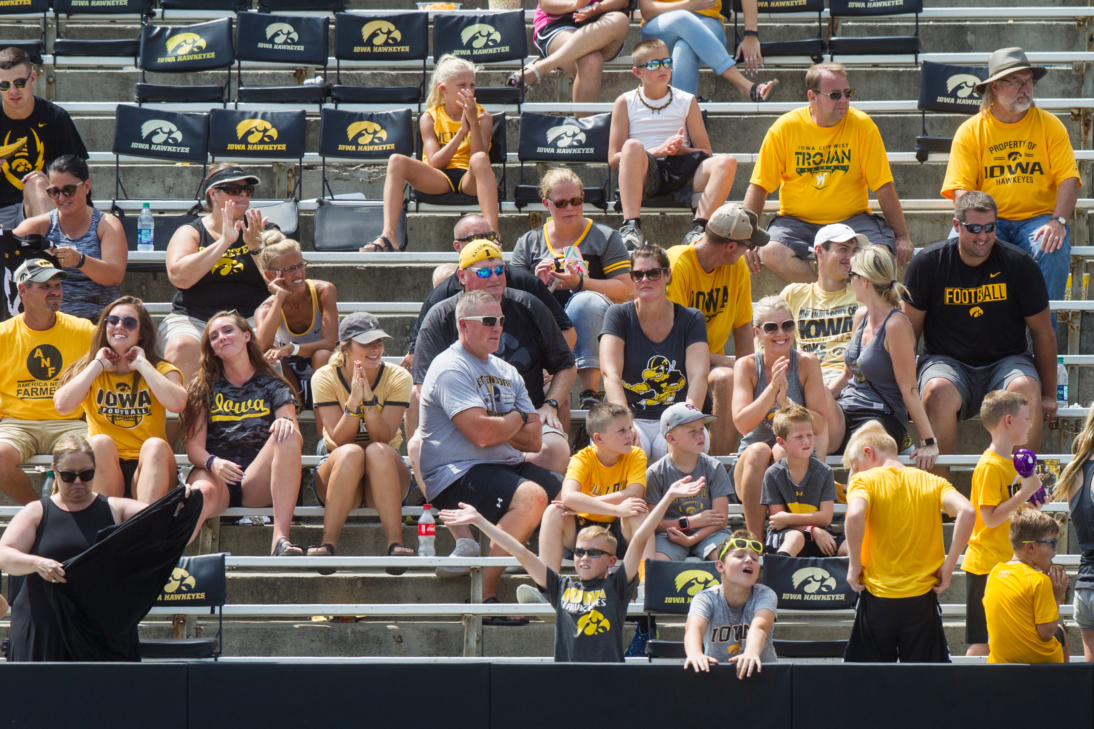 Fans cheer during a Kids Day practice on Saturday, Aug. 11, 2018, at Kinnick Stadium in Iowa City.