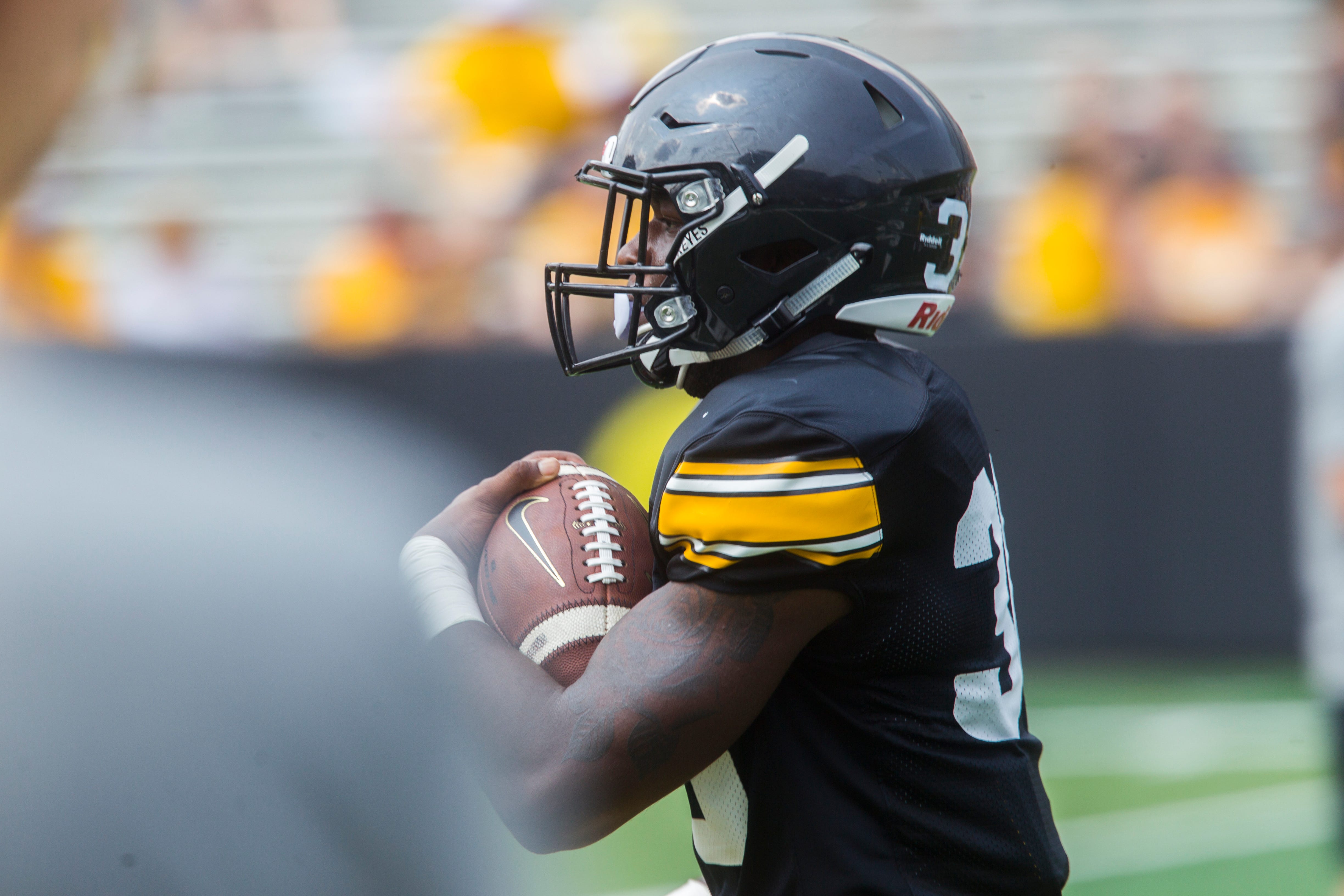 Iowa running back Henry Geil rushes during a Kids Day practice on Saturday, Aug. 11, 2018, at Kinnick Stadium in Iowa City.