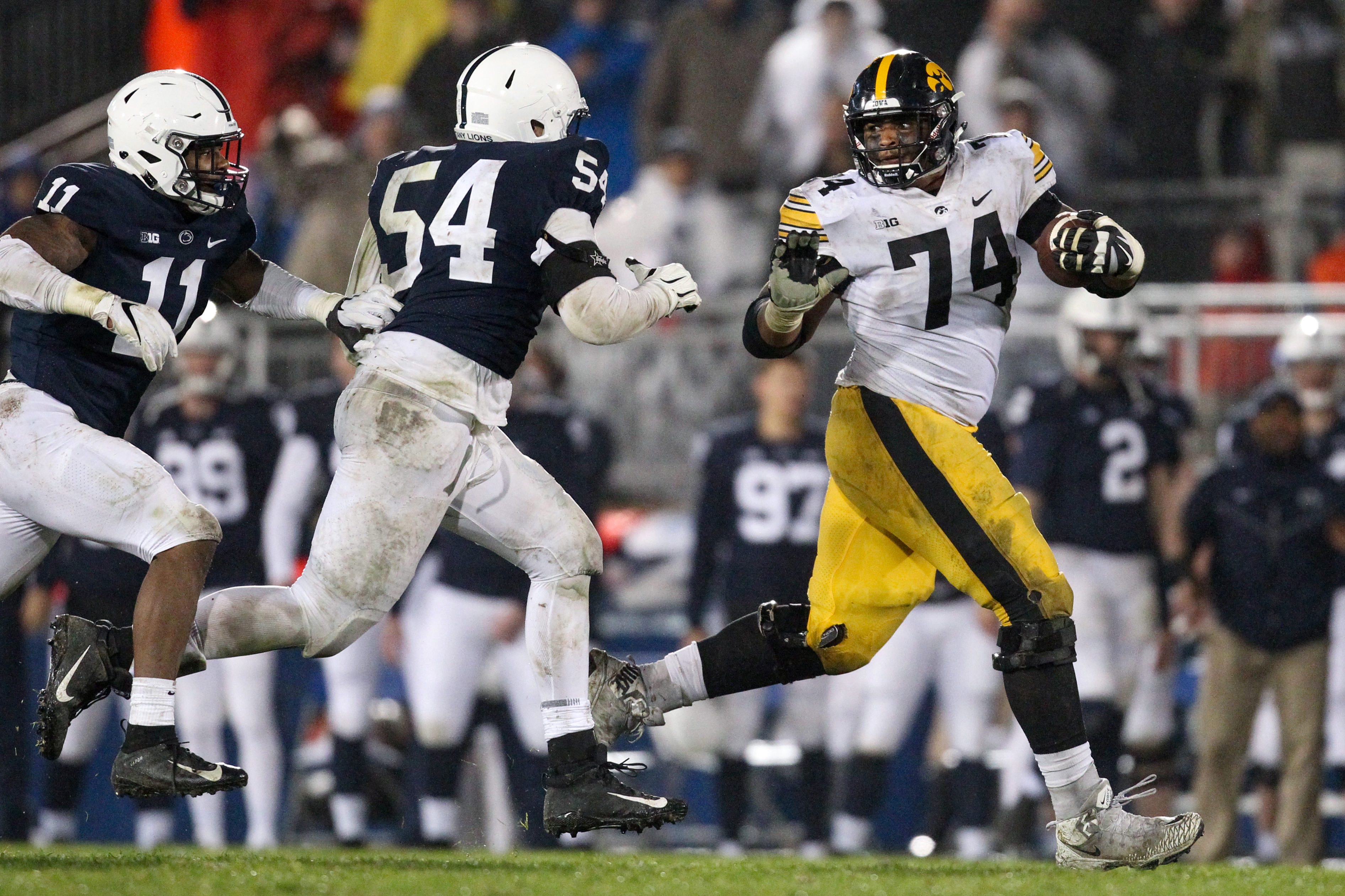 Oct 27, 2018; University Park, PA, USA; Iowa Hawkeyes offensive linesmen Tristan Wirfs (74) runs with the ball during the fourth quarter against the Penn State Nittany Lions at Beaver Stadium. Penn State defeated Iowa 30-24. Mandatory Credit: Matthew O'Haren-USA TODAY Sports
