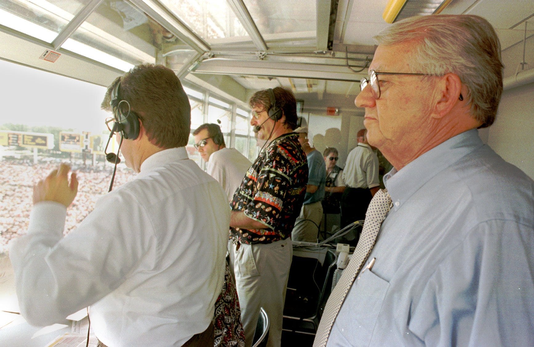 From 1997: Jim Zabel was in an unfamiliar position as an observer at Kinnick Stadium. At left is his replacement, Gary Dolphin, and analyst Ed Podolak.