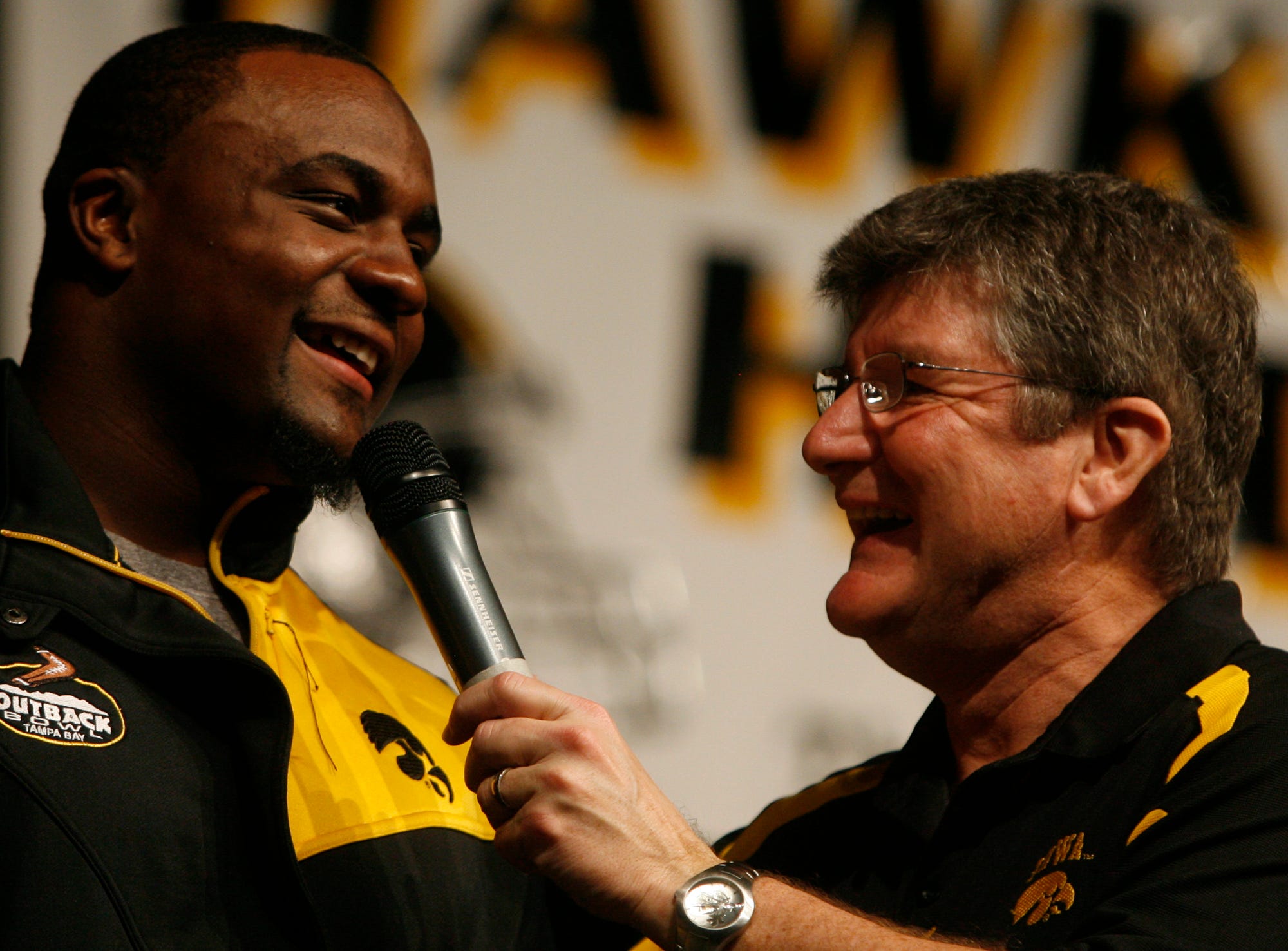 From 2008: Iowa's Shonn Greene laughs while talking with Gary Dolphin during the Hawkeye Huddle in Tampa, Florida.