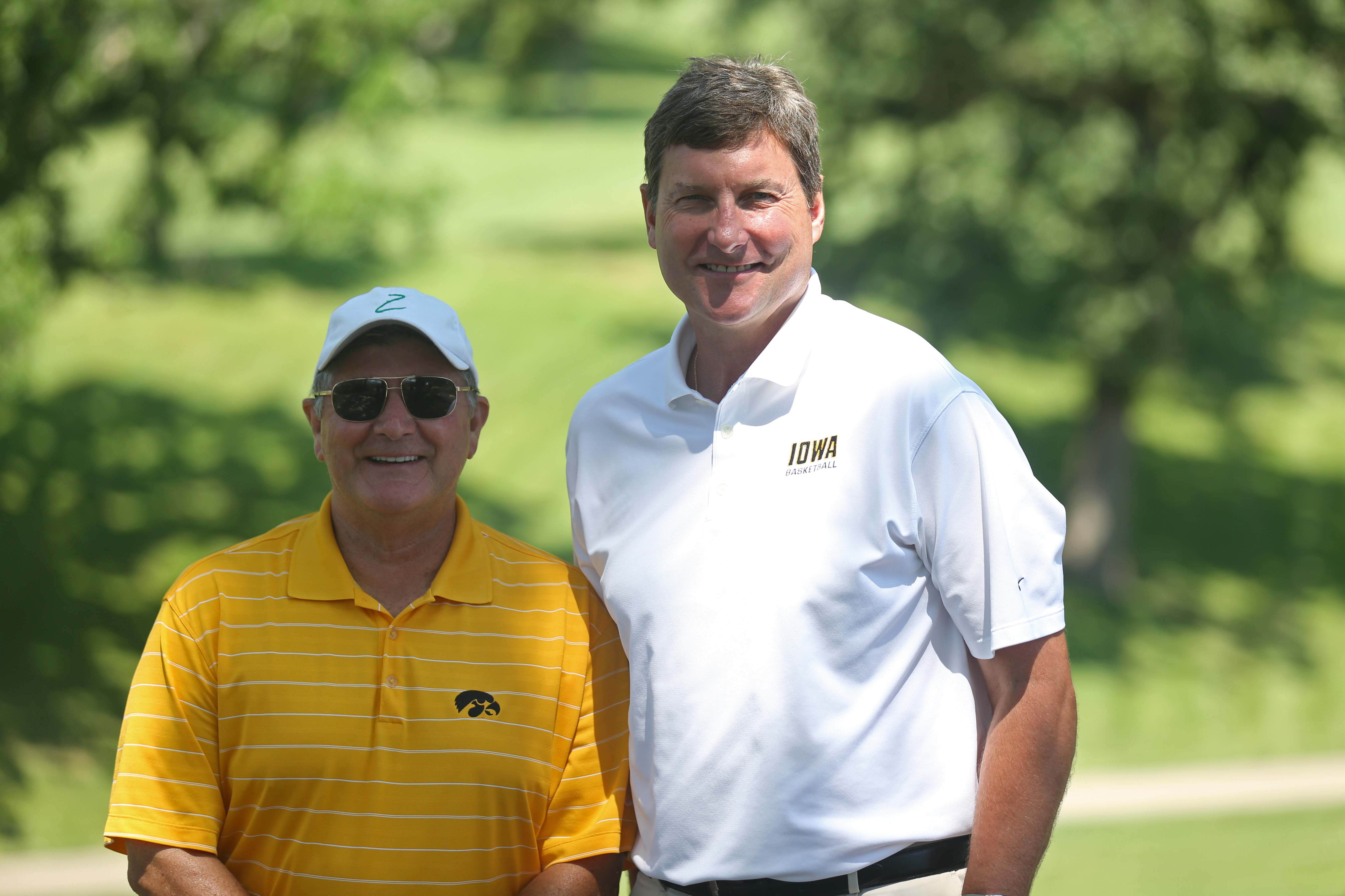 Gary Dolphin and Bobby Hansen, radio announcers for the University of Iowa basketball team pose for a photo during the annual Polk County I-Club golf fundraiser at Wakonda Club in Des Moines on Monday, June 13, 2015.