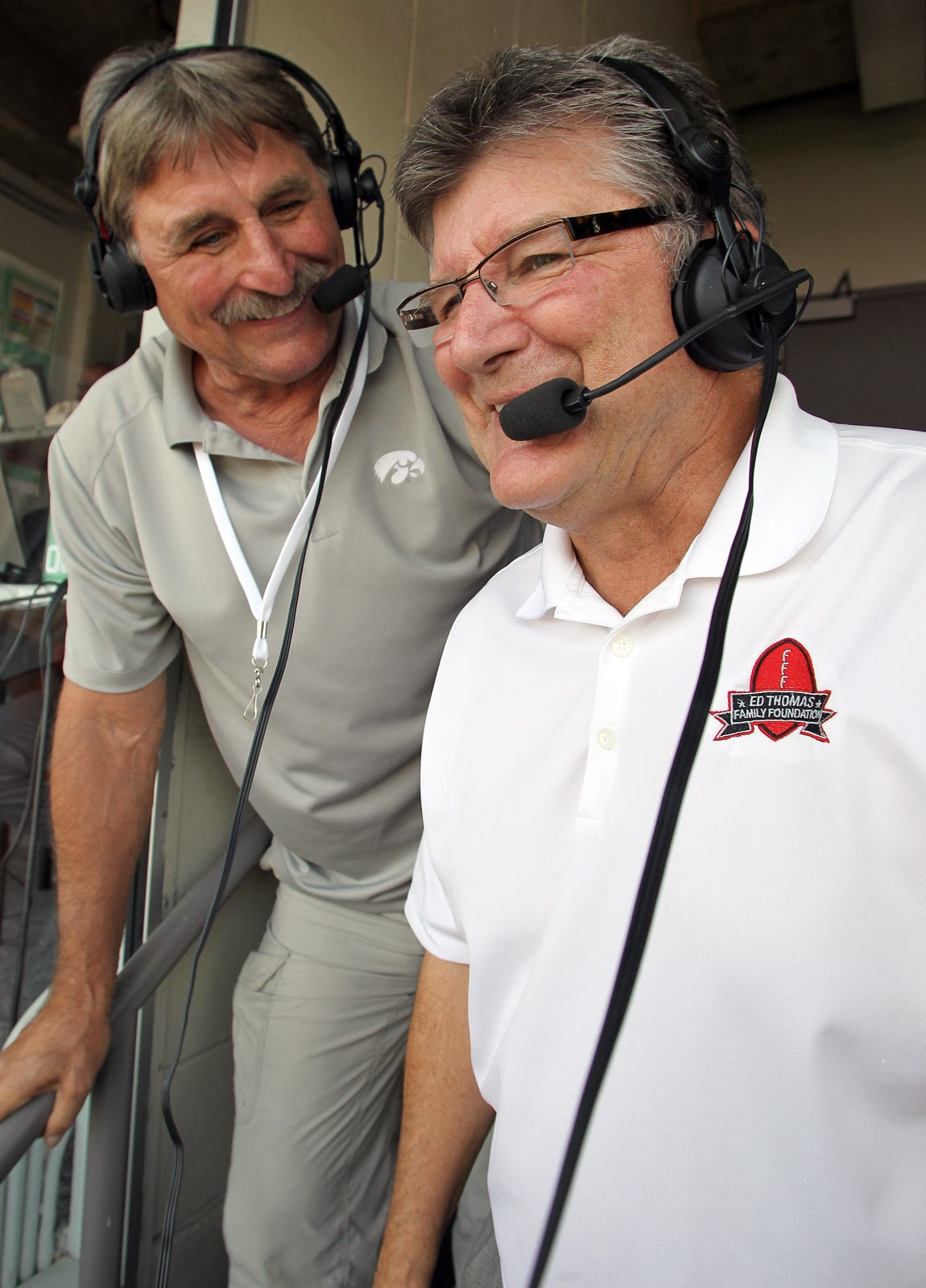 From 2013: Iowa radio analyst Ed Podolak, left, with broadcaster Gary Dolphin, right, says he’s comfortable being removed from the game without the pressure on.