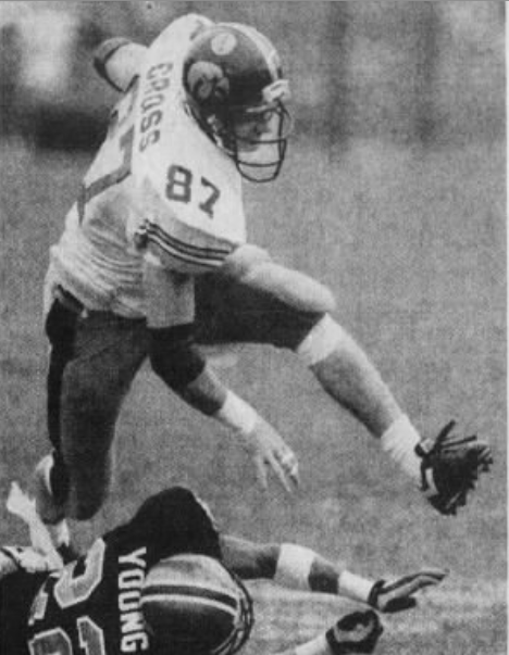 From 1991: Iowa Hawkeyes tight end Alan Cross runs over Purdue's Jimmy Young.