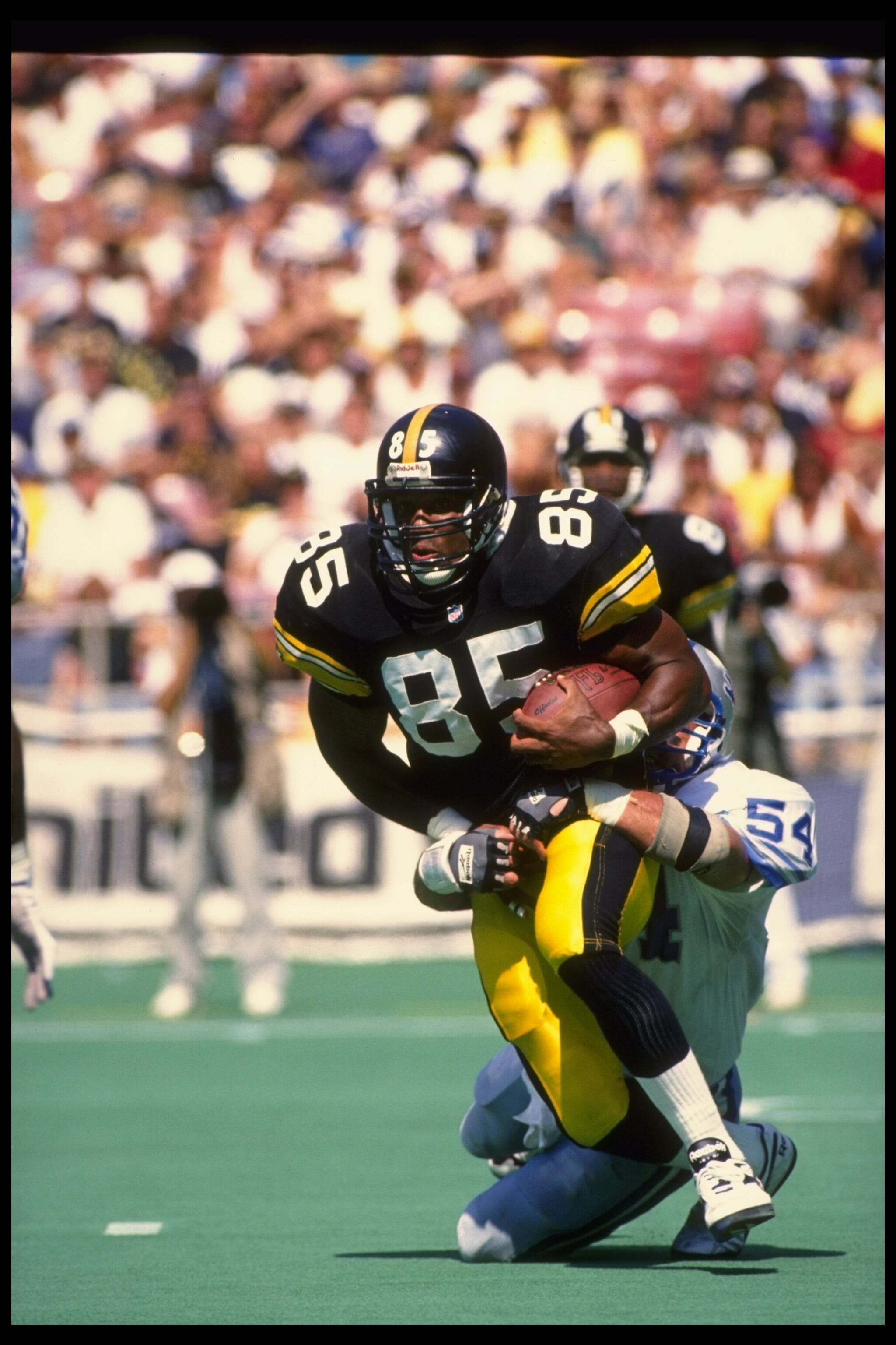 From 1995: Pittsburgh Steelers tight end Jonathan Hayes, a former Iowa Hawkeyes star, is brought down by Detroit Linebacker Chris Spielman.