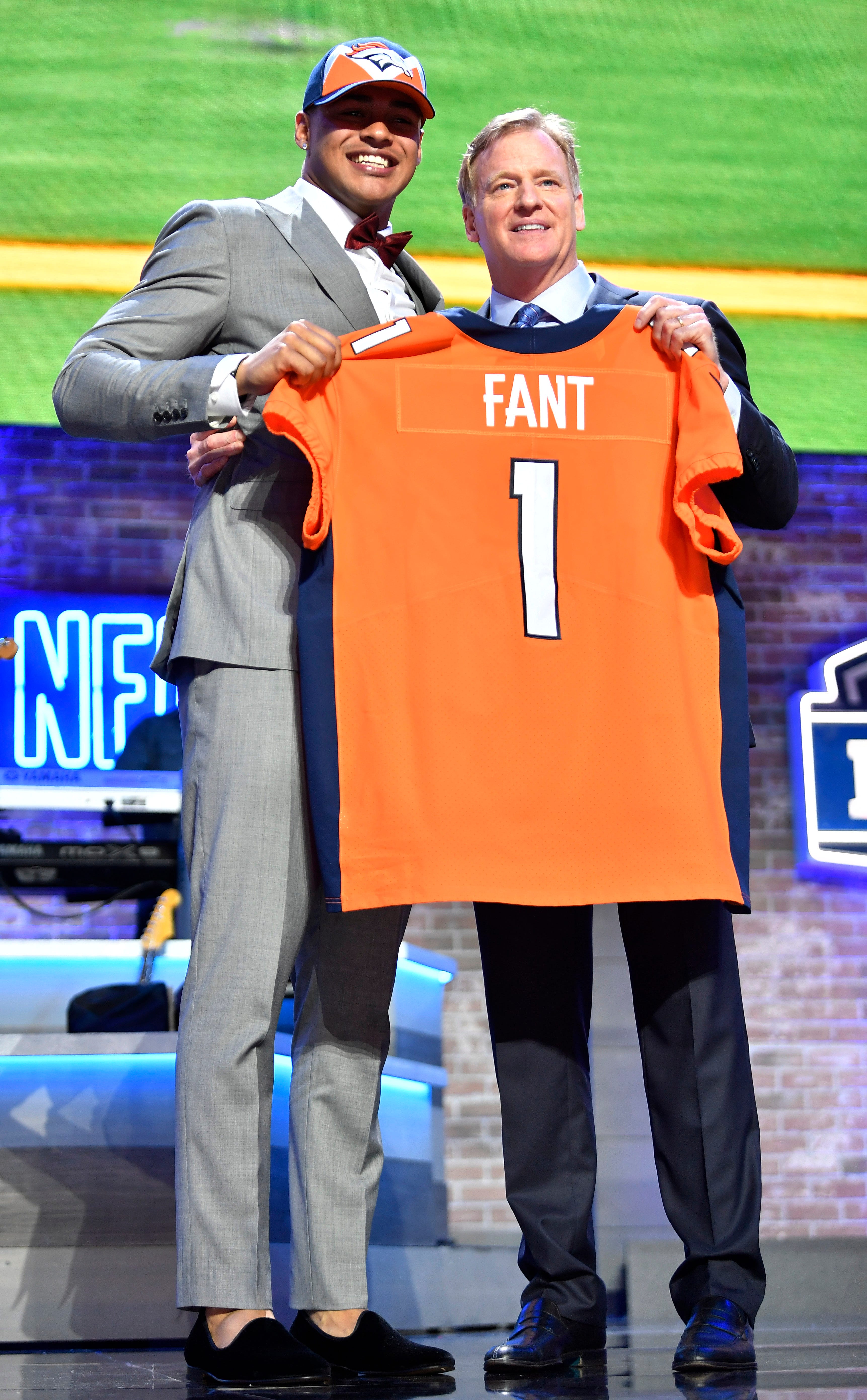 Noah Fant celebrates his pick by the Denver Broncos with NFL Commissioner Roger Goodell during the first round of the NFL Draft Thursday, April 25, 2019, in Nashville, Tenn.