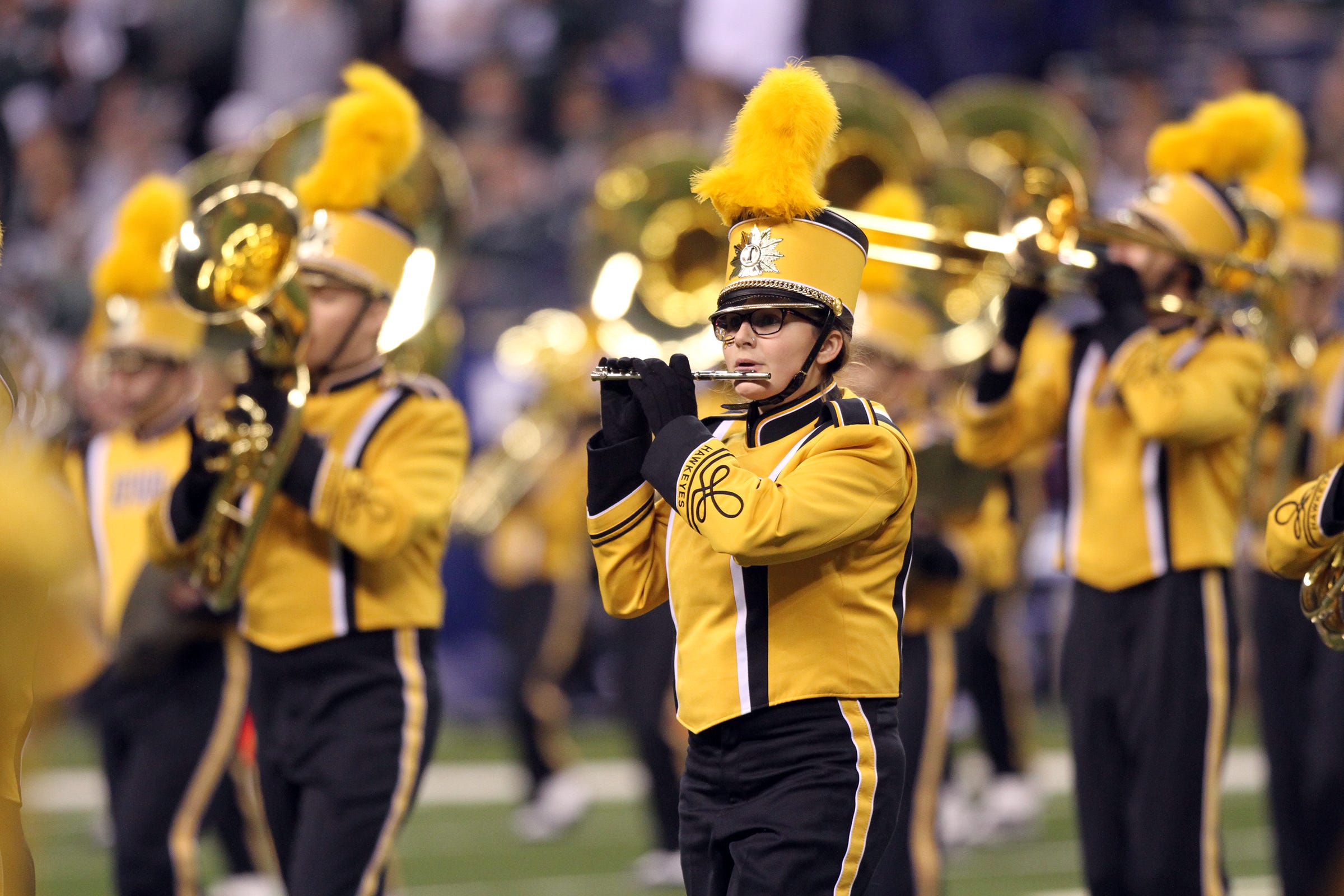 The Hawkeye Marching Band performs prior to Iowa's Big Ten Championship game against Michigan State at Lucas Oil Stadium in Indianapolis, Ind. on Saturday, Dec. 5, 2015.
