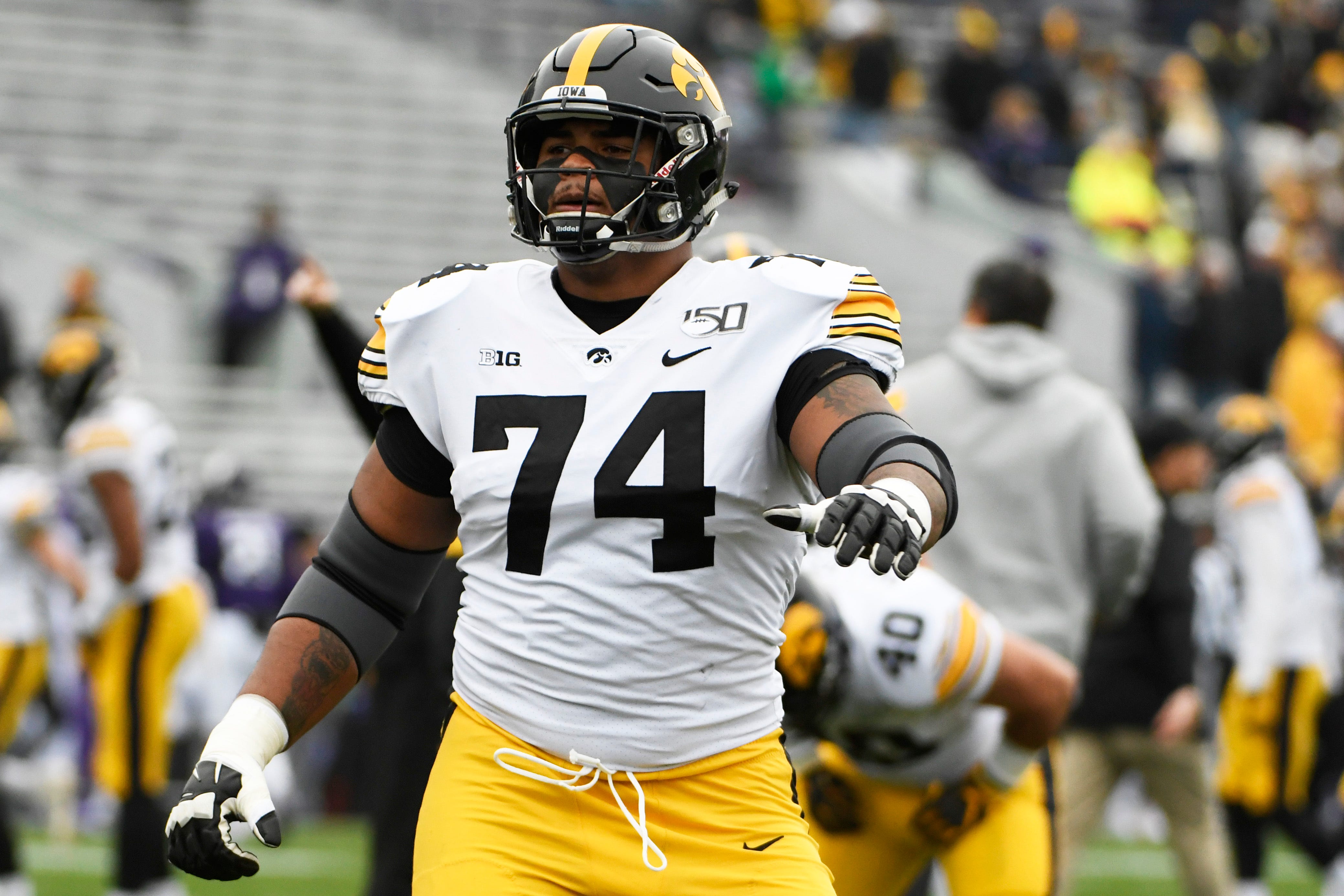 Iowa offensive lineman Tristan Wirfs (74) warms ups before a game against Northwestern an NCAA college football game, Saturday, Oct. 26, 2019, in Evanston, Ill. (AP Photo/David Banks)
