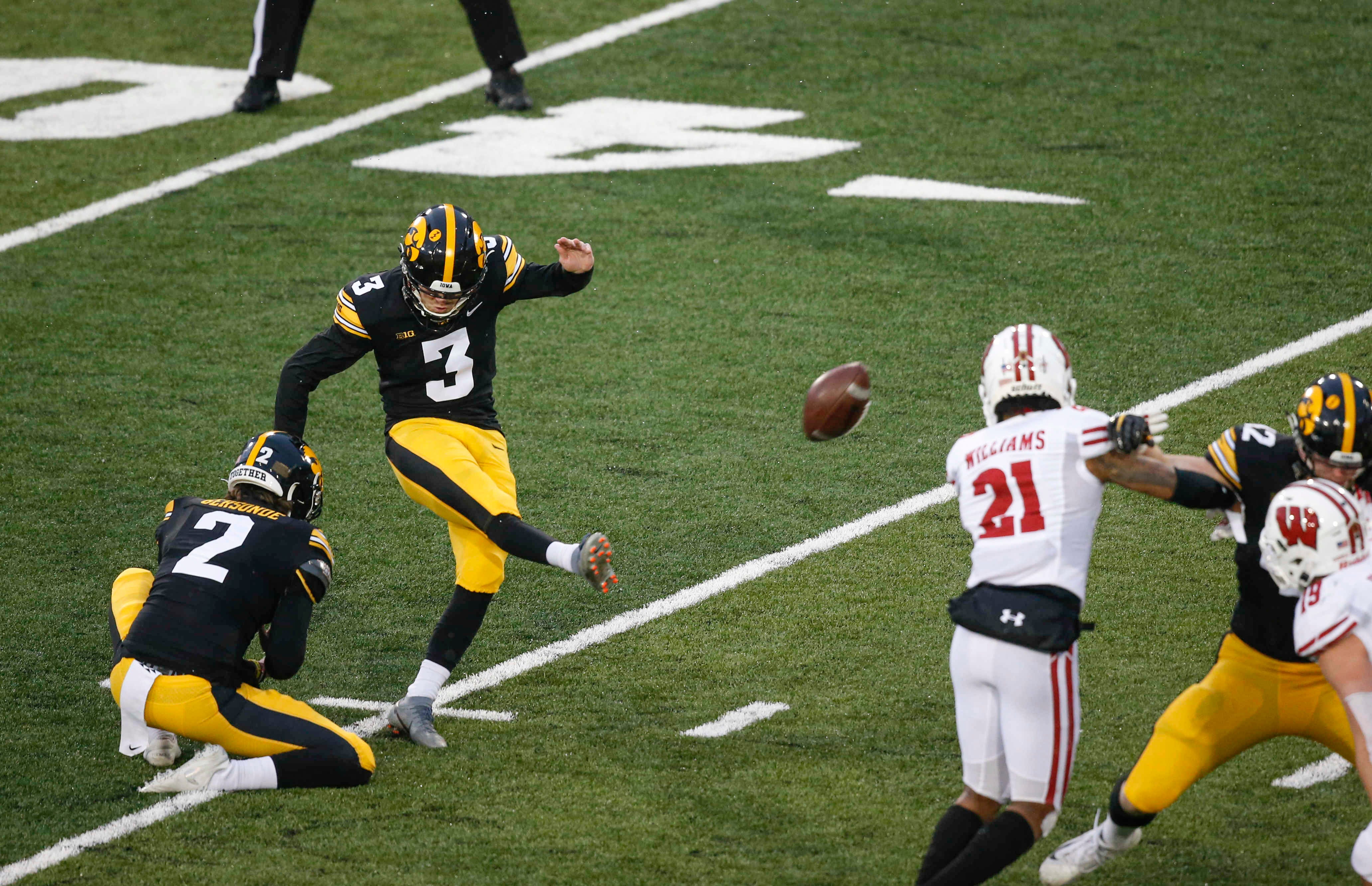 Iowa senior place kicker Keith Duncan strikes the ball for a field goal in the second quarter against Wisconsin on Saturday, Dec. 12, 2020, at Kinnick Stadium in Iowa City, Iowa.