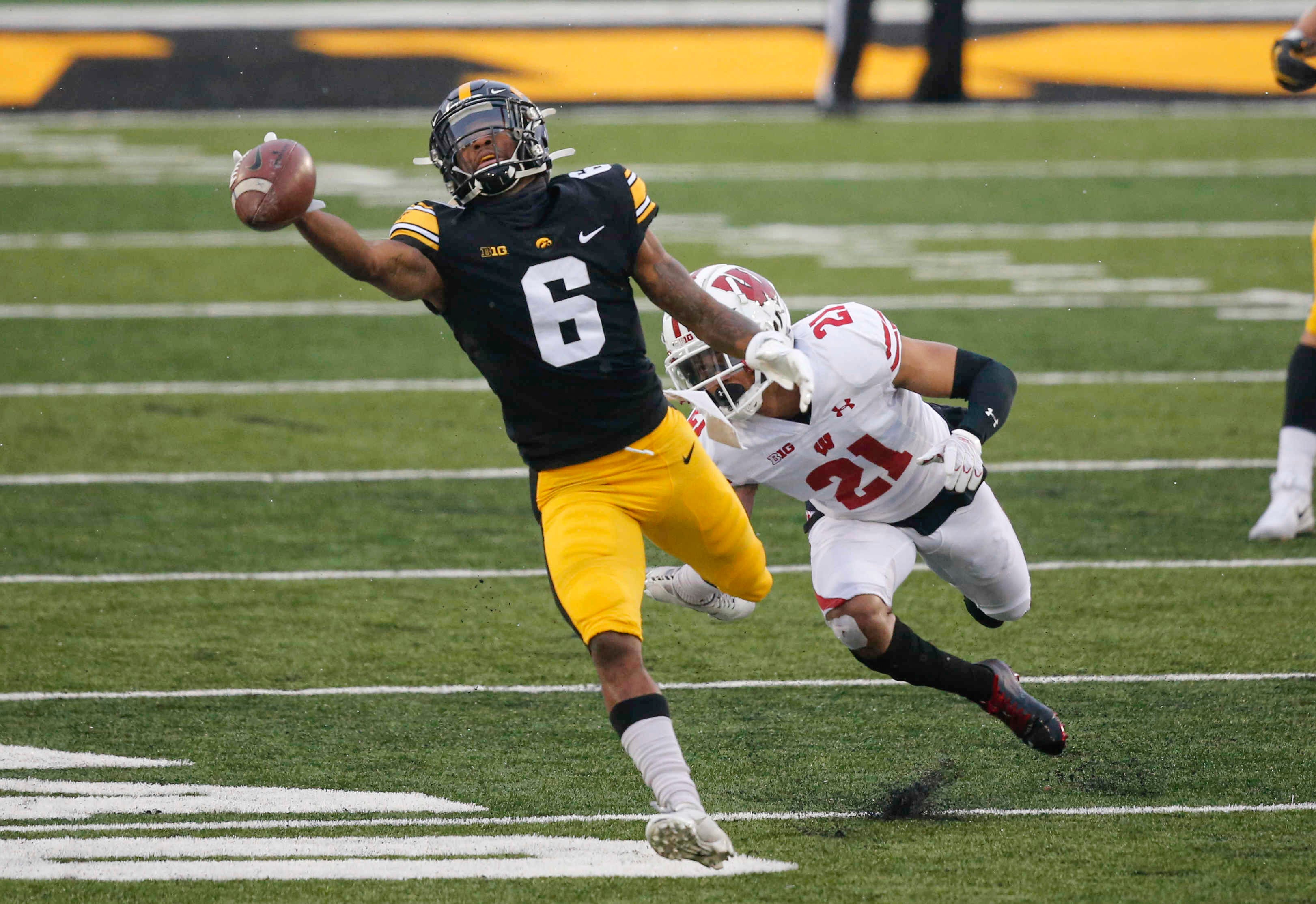 Iowa senior receiver Ihmir Smith-Marsette reaches for an overthrown pass in the second quarter against Wisconsin on Saturday, Dec. 12, 2020, at Kinnick Stadium in Iowa City, Iowa.