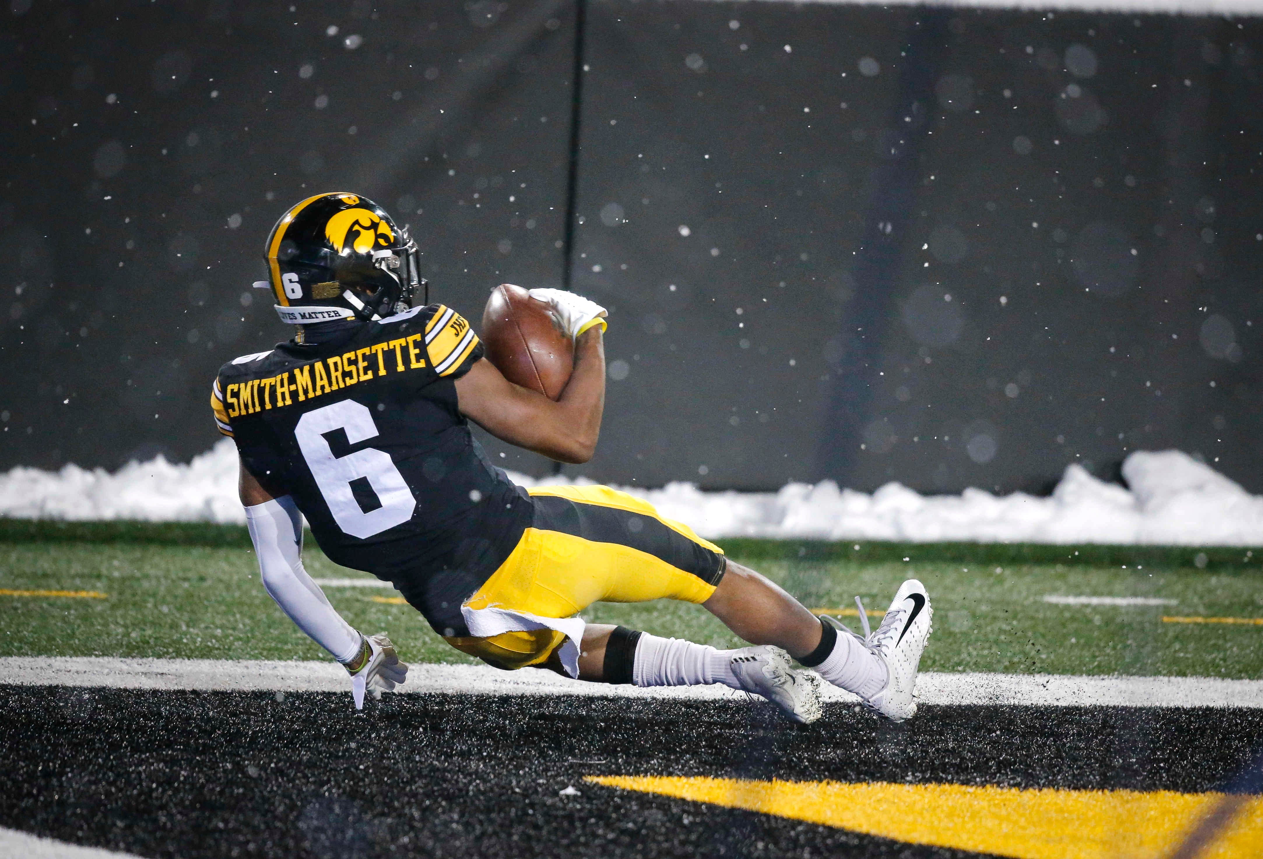 Iowa senior receiver Ihmir Smith-Marsette performs a flip after pulling down a touchdown reception in the third quarter against Wisconsin on Saturday, Dec. 12, 2020, at Kinnick Stadium in Iowa City, Iowa.