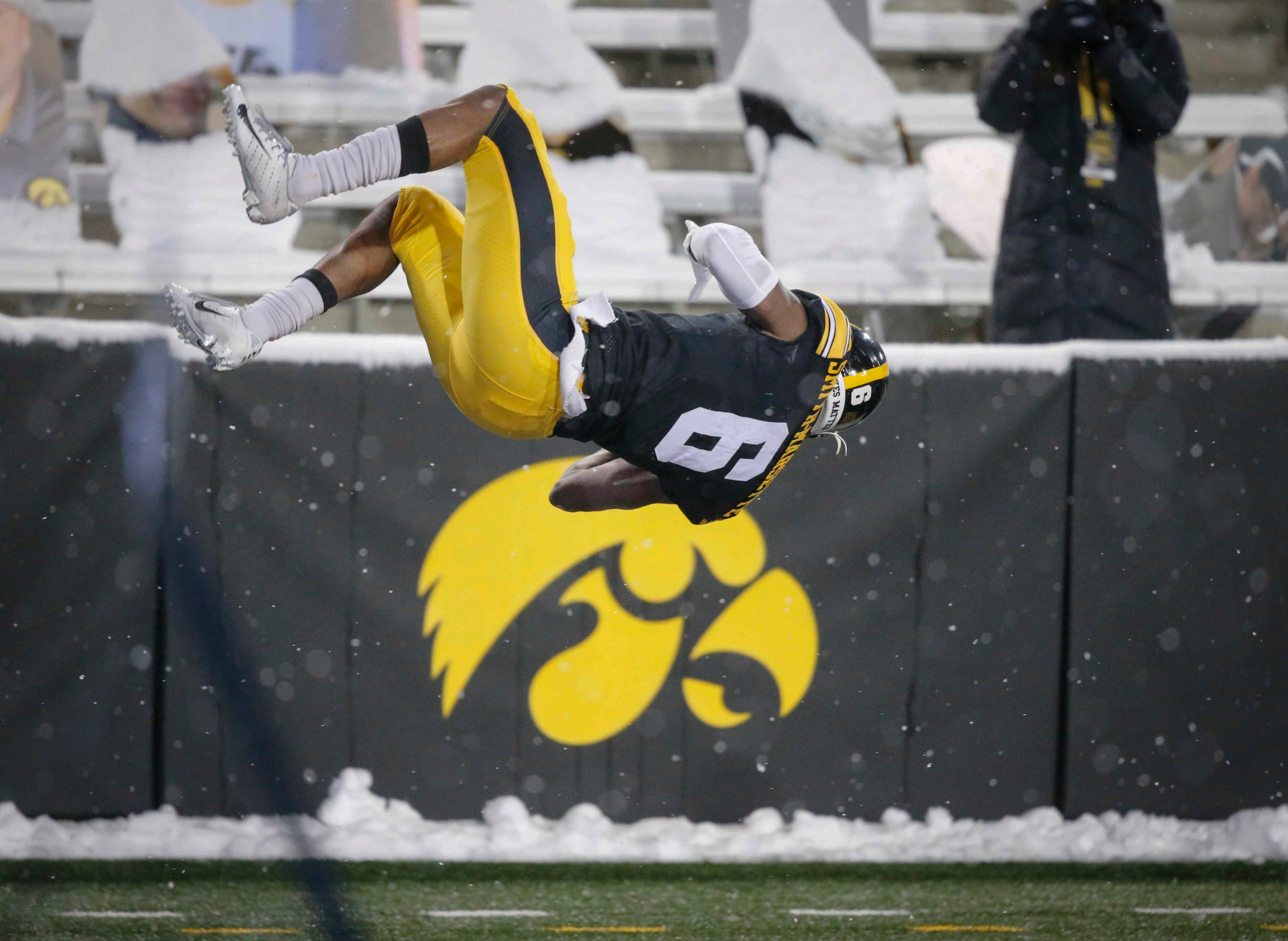 Iowa senior receiver Ihmir Smith-Marsette performs a flip after pulling down a touchdown reception in the third quarter against Wisconsin on Saturday, Dec. 12, 2020, at Kinnick Stadium in Iowa City, Iowa.