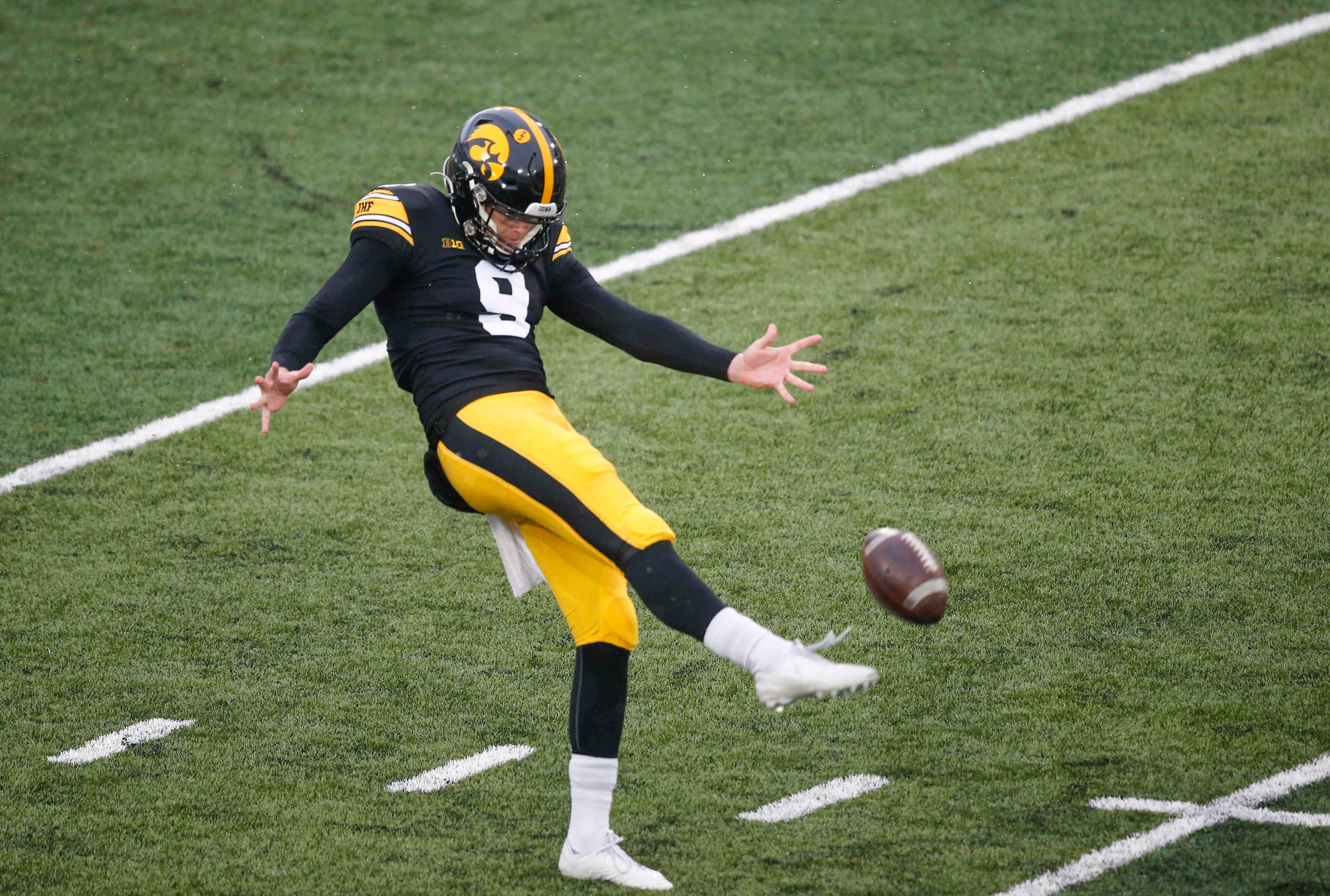Iowa punter Tory Taylor punts the ball in the second quarter against Wisconsin on Saturday, Dec. 12, 2020, at Kinnick Stadium in Iowa City, Iowa.