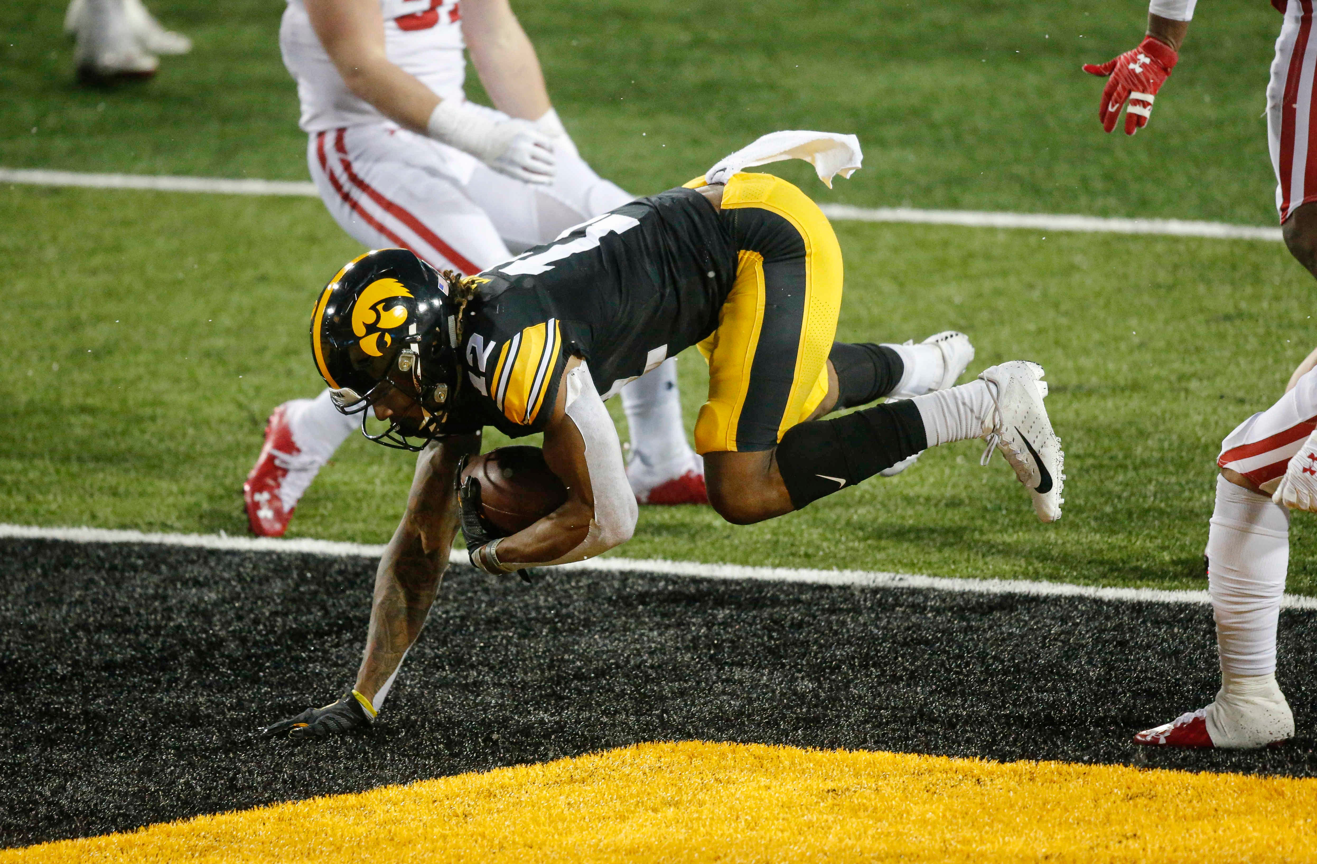 Iowa senior receiver Brandon Smith leaps into the endzone to complete a two-point conversion in the third quarter against Wisconsin on Saturday, Dec. 12, 2020, at Kinnick Stadium in Iowa City, Iowa.
