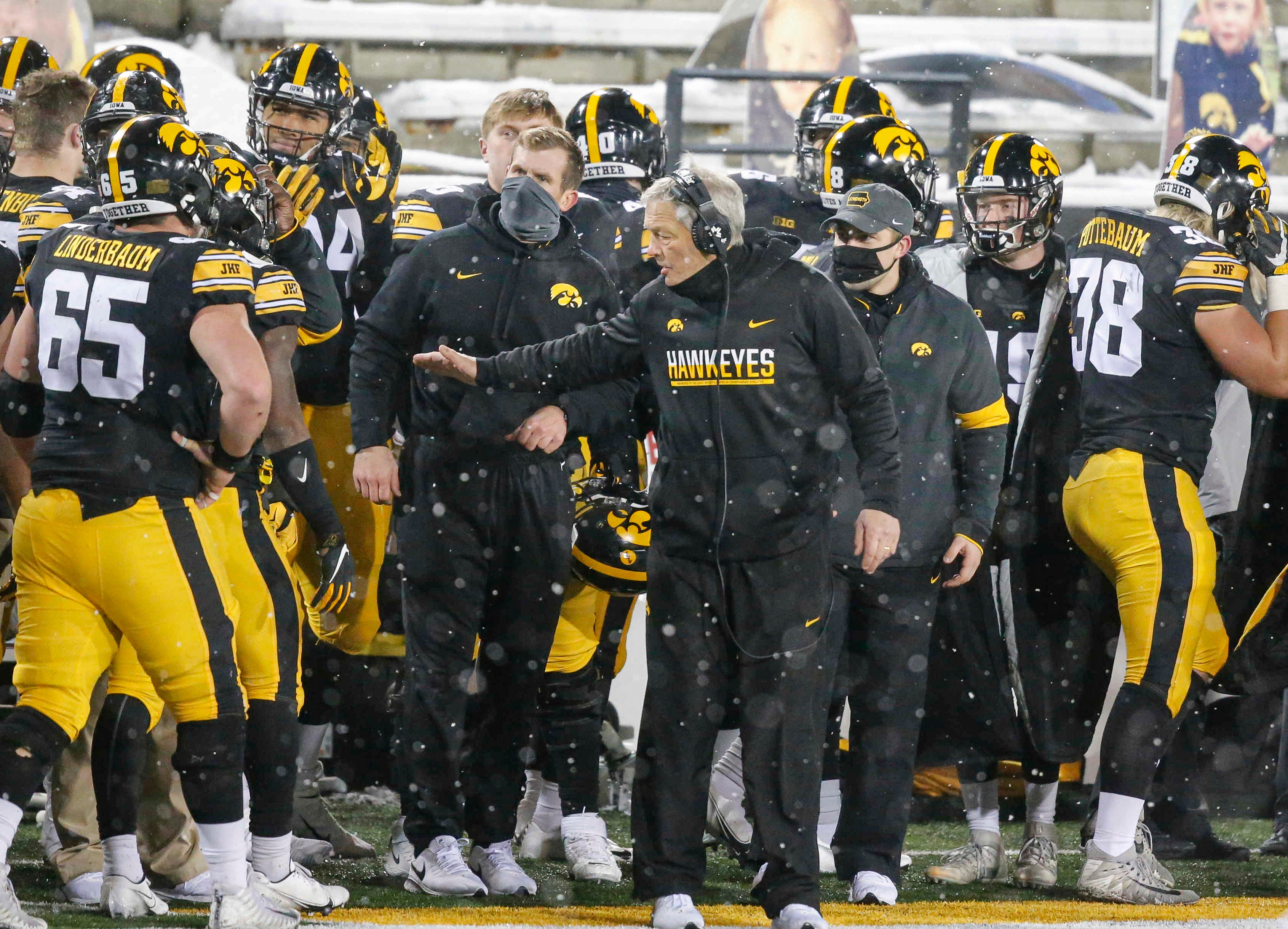 Iowa head football coach Kirk Ferentz celebrates with his team after the Hawkeyes scored a touchdown against Wisconsin in the third quarter on Saturday, Dec. 12, 2020, at Kinnick Stadium in Iowa City, Iowa.