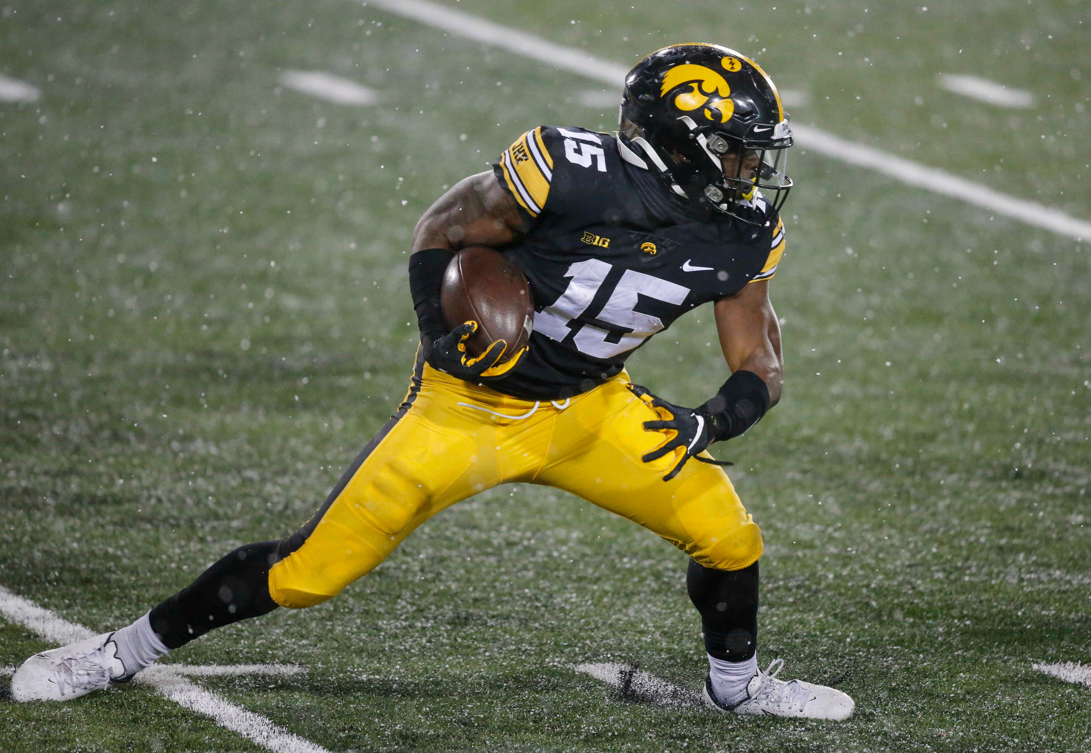 Iowa sophomore running back Tyler Goodson runs for a touchdown in the fourth quarter against Wisconsin on Saturday, Dec. 12, 2020, at Kinnick Stadium in Iowa City, Iowa.