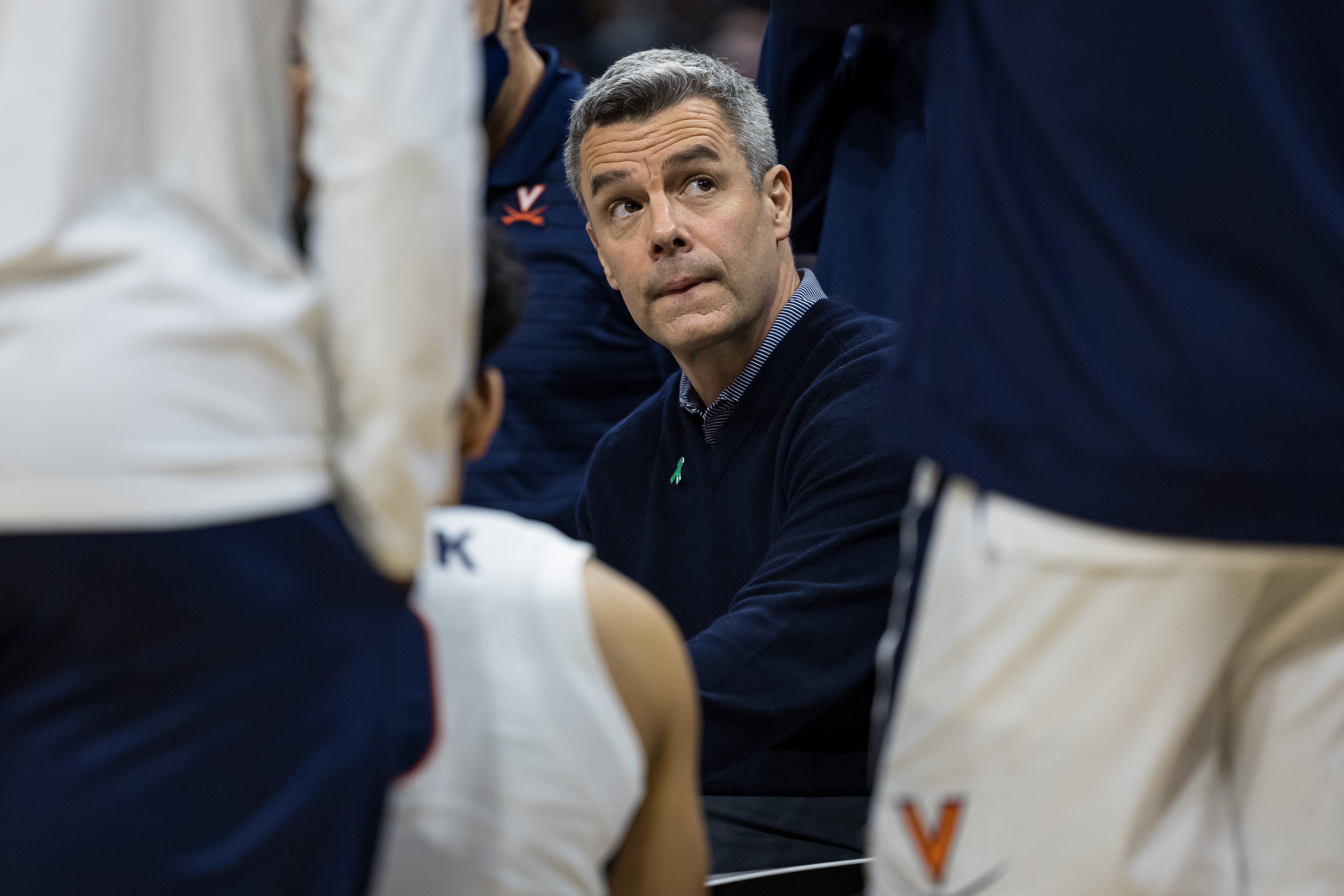 Virginia Cavaliers head coach Tony Bennett looks on from a team huddle during the second half of the game against the Iowa Hawkeyes, Monday, Nov. 29, 2021, at John Paul Jones Arena in Charlottesville, Va.